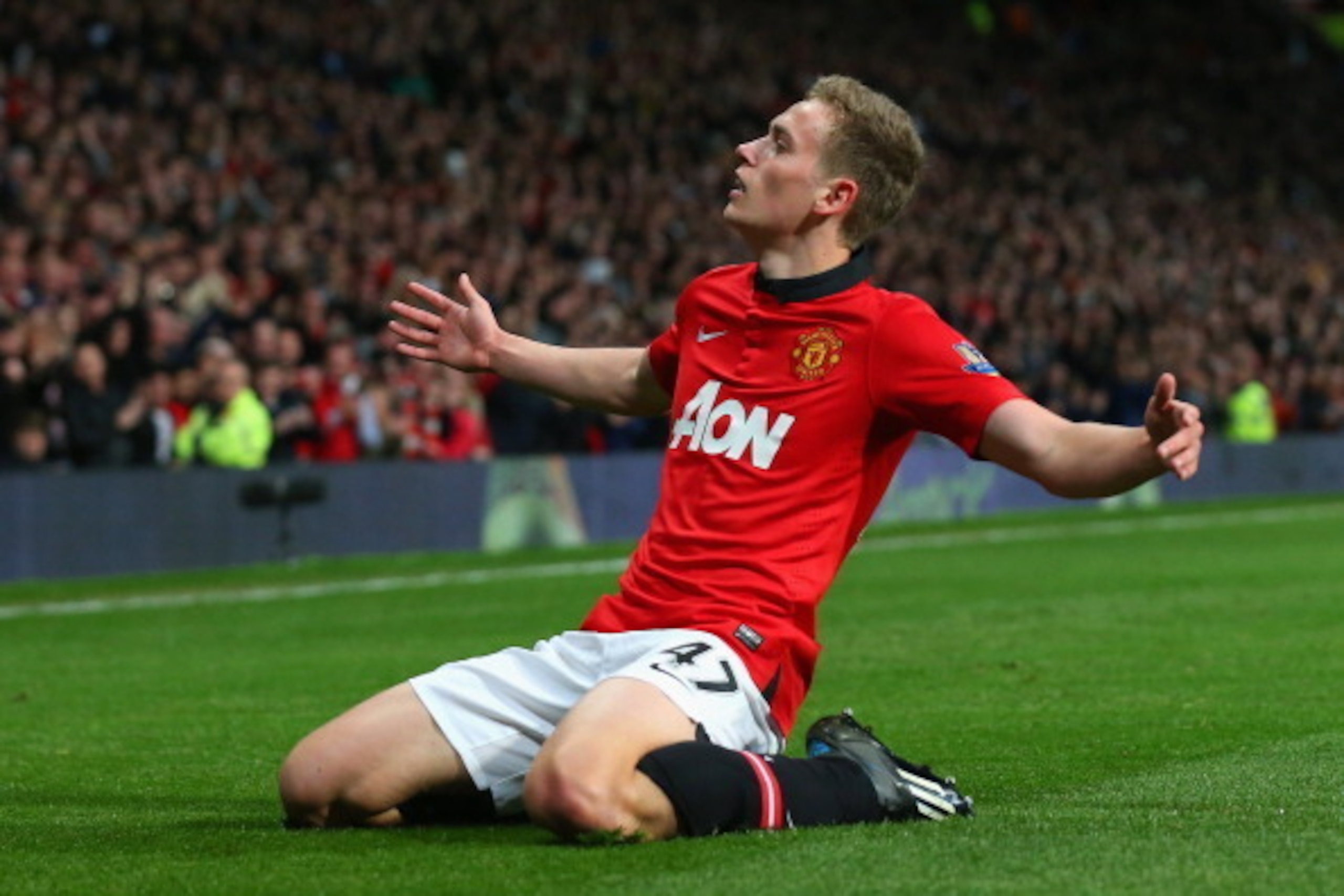 MANCHESTER, ENGLAND - MAY 06:  James Wilson of Manchester United celebrates scoring the second goal during the Barclays Premier League match between Manchester United and Hull City at Old Trafford on May 6, 2014 in Manchester, England.  (Photo by Alex Liv