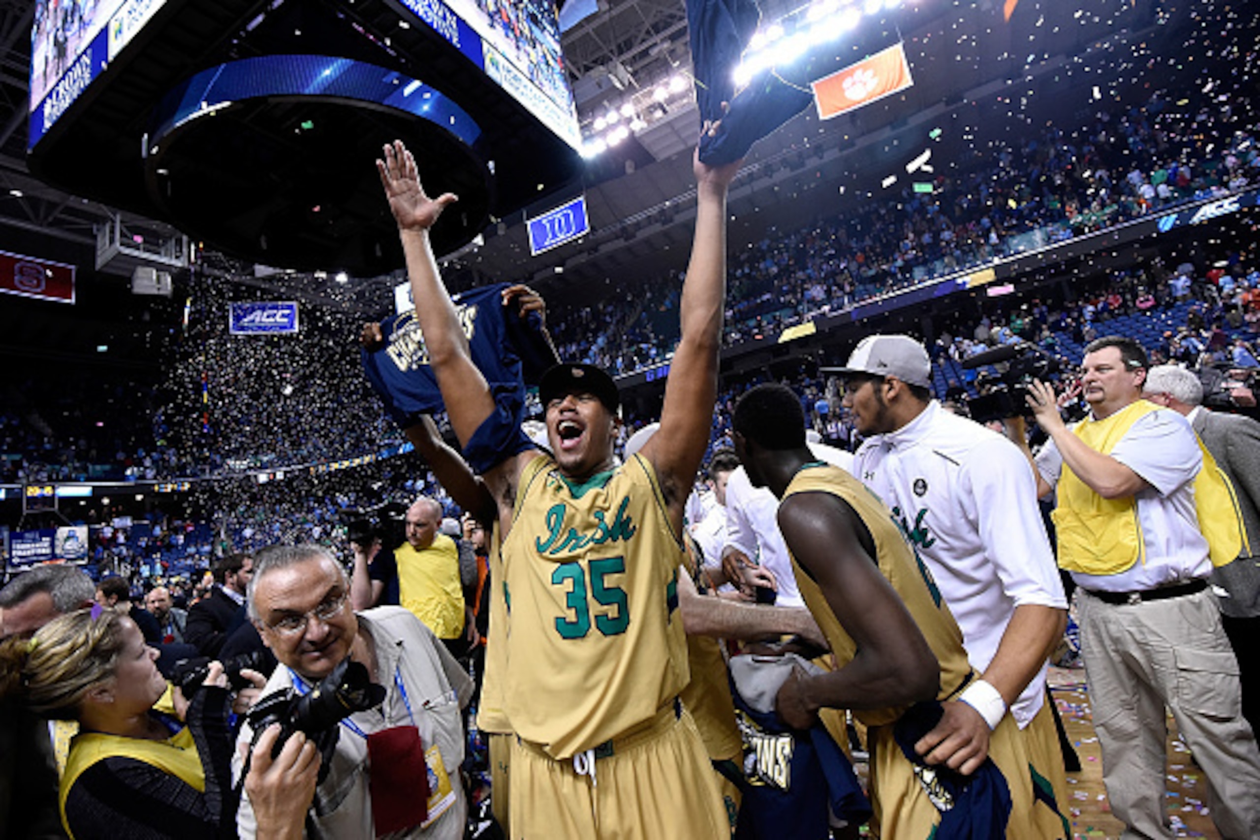 GREENSBORO, NC - MARCH 14:  Bonzie Colson #35 and the Notre Dame Fighting Irish celebrate after defeating the North Carolina Tar Heels during the championship game of the ACC Basketball Tournament at Greensboro Coliseum on March 14, 2015 in Greensboro, No