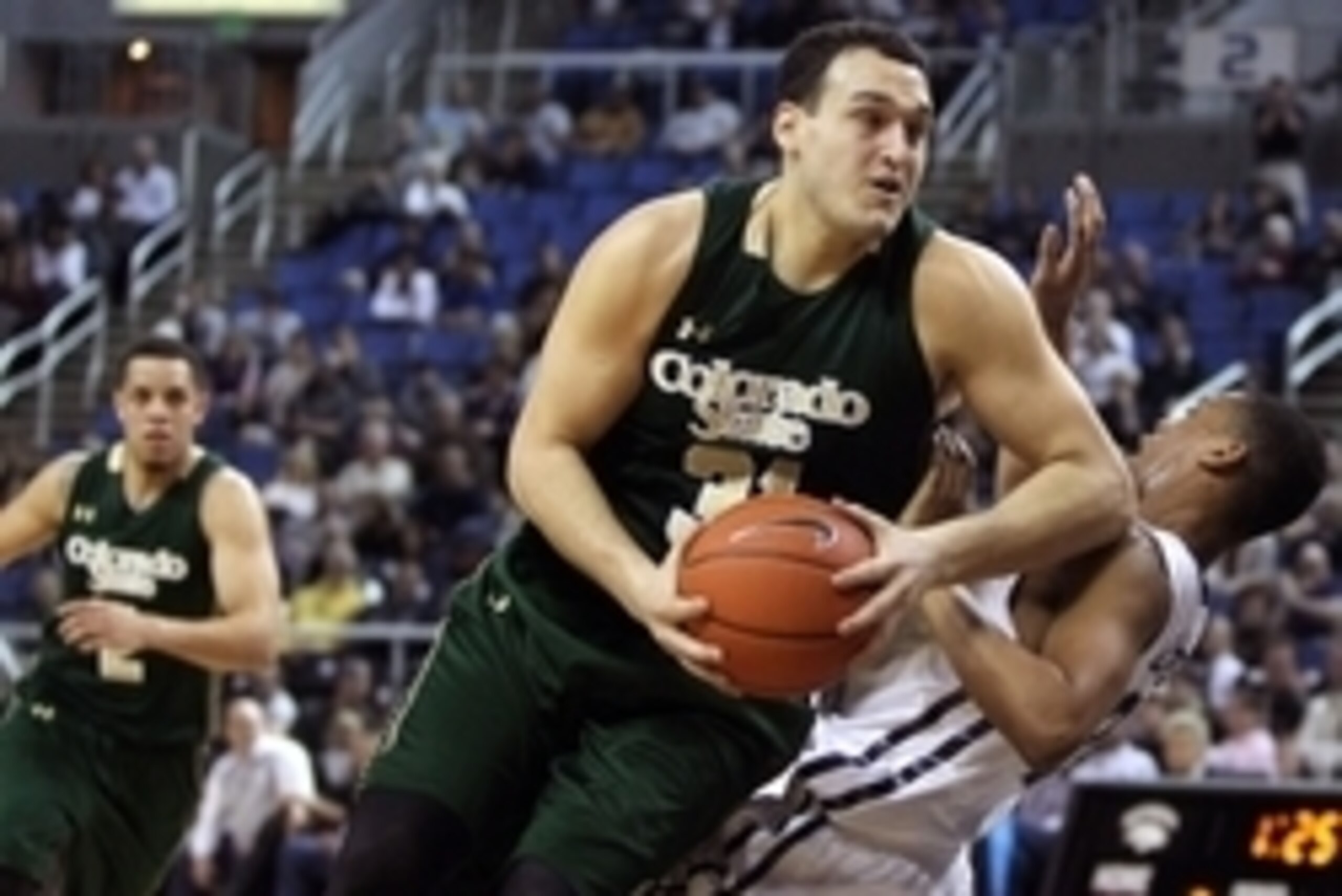 Mar 4, 2015; Reno, NV, USA; Colorado State Rams forward J.J. Avila (31) drives the ball past Nevada Wolf Pack guard Eric Cooper Jr. (21) in the first half of their NCAA basketball game at Lawlor Events Center. Mandatory Credit: Lance Iversen-USA TODAY Spo