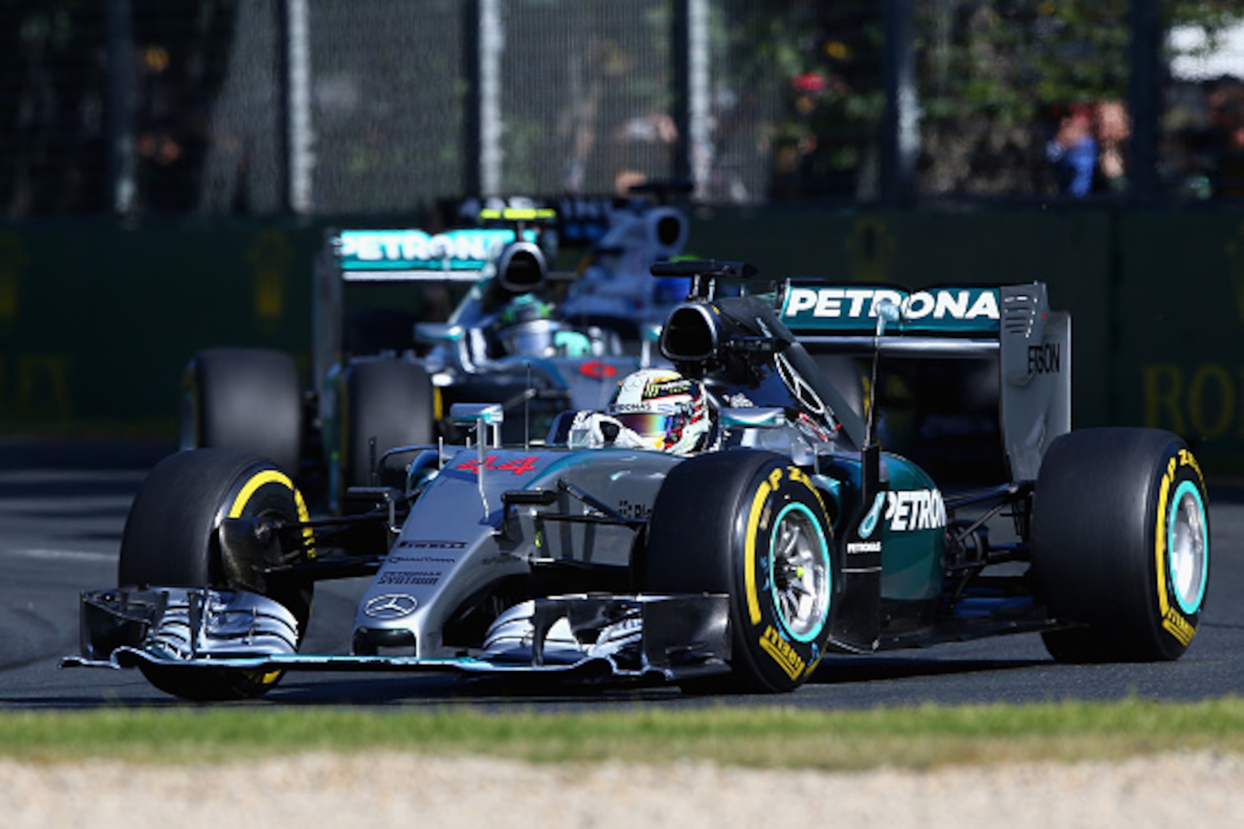 MELBOURNE, AUSTRALIA - MARCH 15: Lewis Hamilton of Great Britain and Mercedes GP leads Nico Rosberg of Germany and Mercedes GP during the Australian Formula One Grand Prix at Albert Park on March 15, 2015 in Melbourne, Australia. (Photo by Robert Cianfl MELBOURNE, AUSTRALIA - MARCH 15: Lewis Hamilton of Great Britain and Mercedes GP leads Nico Rosberg of Germany and Mercedes GP during the Australian Formula One Grand Prix at Albert Park on March 15, 2015 in Melbourne, Australia. (Photo by Robert Cianfl