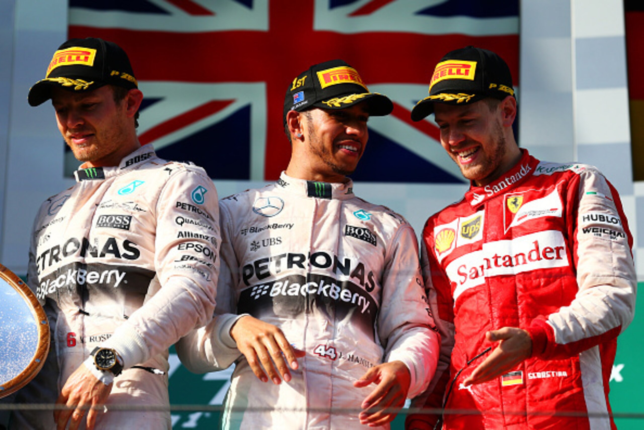 MELBOURNE, AUSTRALIA - MARCH 15: (L-R) Nico Rosberg of Germany and Mercedes GP, Lewis Hamilton of Great Britain and Mercedes GP and Sebastian Vettel of Germany and Ferrari celebrate on the podium after the Australian Formula One Grand Prix at Albert Park MELBOURNE, AUSTRALIA - MARCH 15: (L-R) Nico Rosberg of Germany and Mercedes GP, Lewis Hamilton of Great Britain and Mercedes GP and Sebastian Vettel of Germany and Ferrari celebrate on the podium after the Australian Formula One Grand Prix at Albert Park