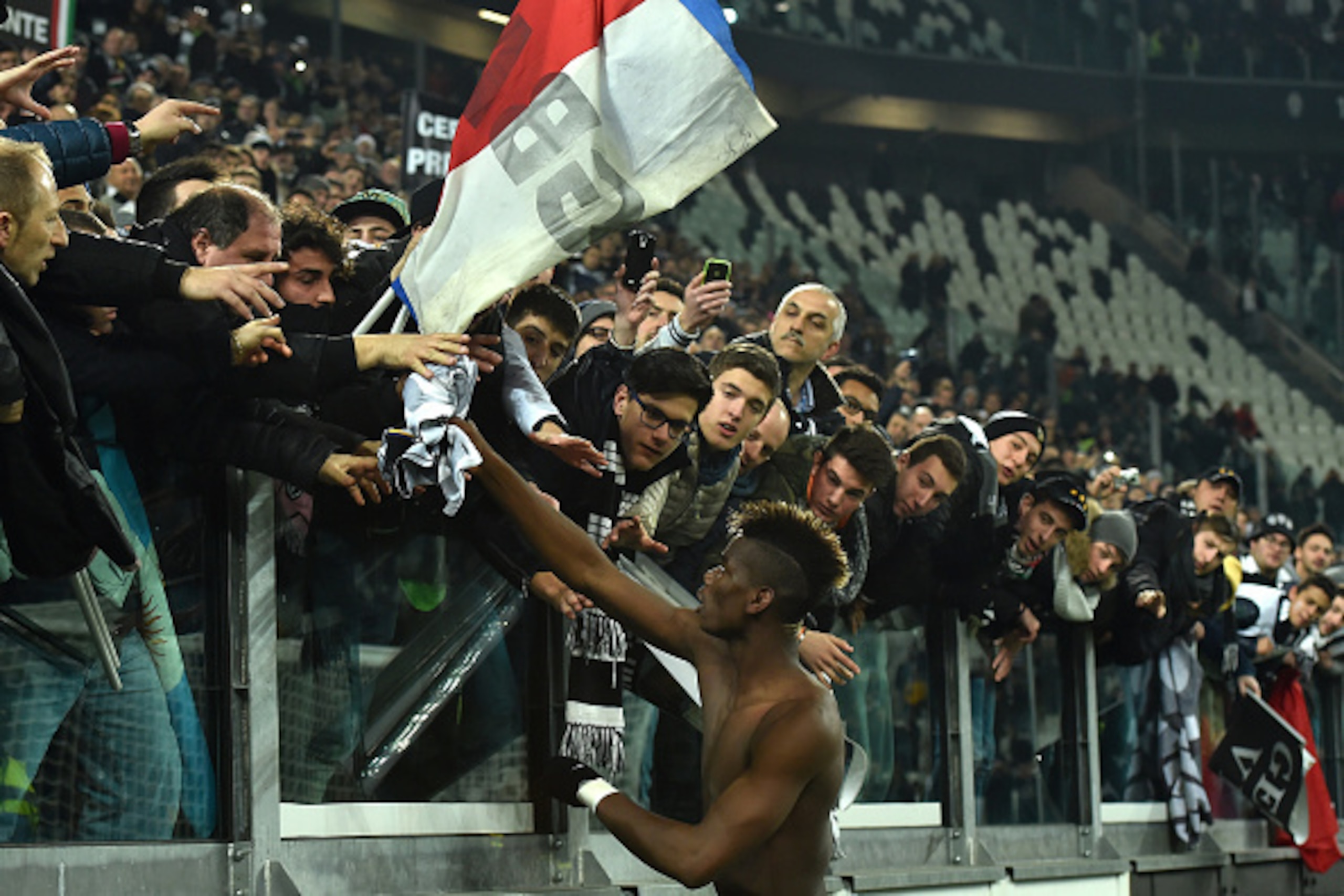 TURIN, ITALY - MARCH 09:  Paul Pogba of Juventus FC celebrates the victory with the fans at the end of the Serie A match between Juventus FC and US Sassuolo Calcio at Juventus Arena on March 9, 2015 in Turin, Italy.  (Photo by Valerio Pennicino/Getty Imag