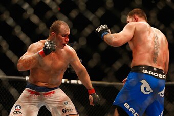 PHOENIX, AZ - DECEMBER 13:  Junior dos Santos (L) and Stipe Miocic square off in their heavyweight bout during the UFC Fight Night event at the at U.S. Airways Center on December 13, 2014 in Phoenix, Arizona.  (Photo by Christian Petersen/Getty Images)