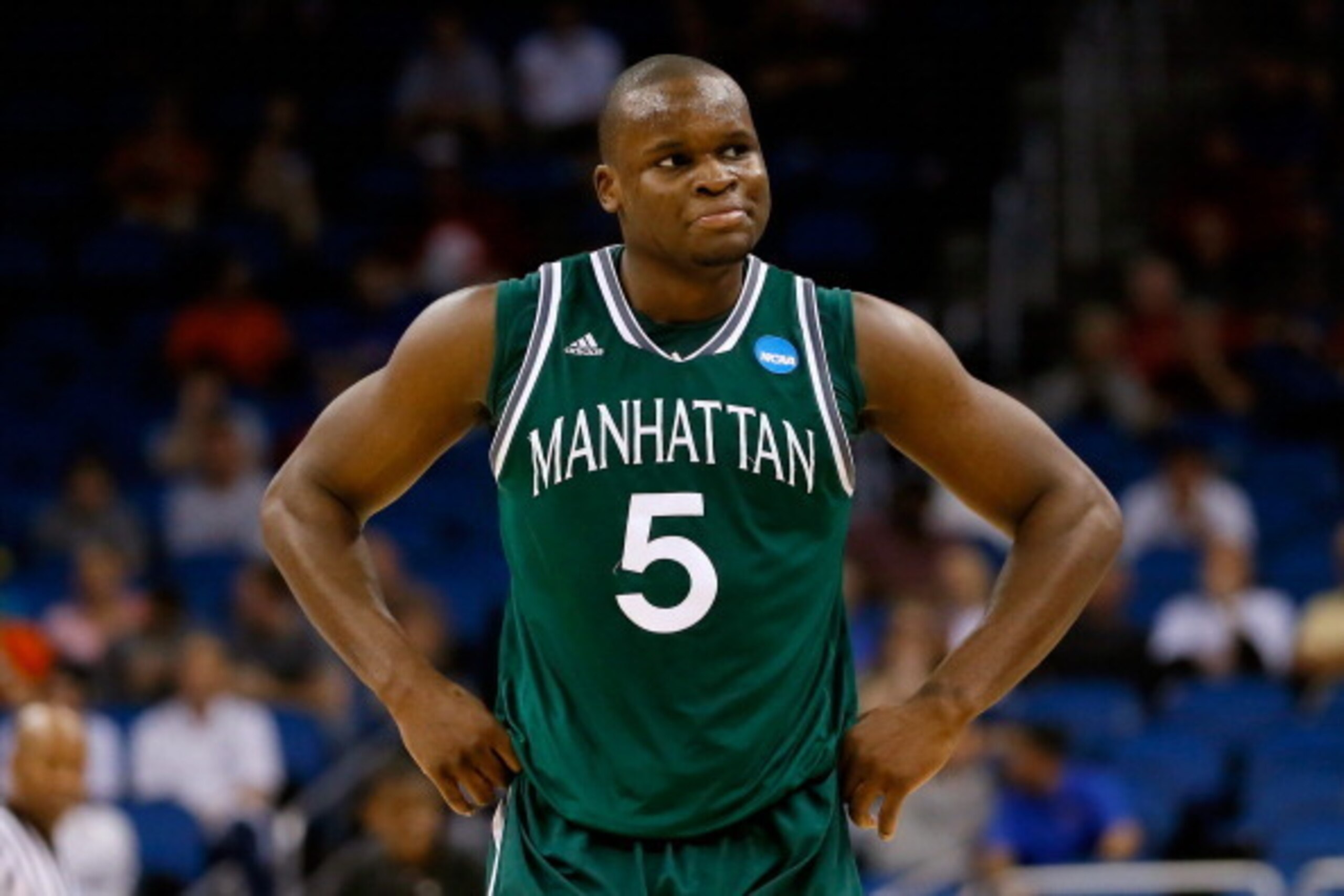 ORLANDO, FL - MARCH 20:  Rhamel Brown #5 of the Manhattan Jaspers reacts after fouling out against the Louisville Cardinals in the second half during the second round of the 2014 NCAA Men's Basketball Tournament at Amway Center on March 20, 2014 in Orland
