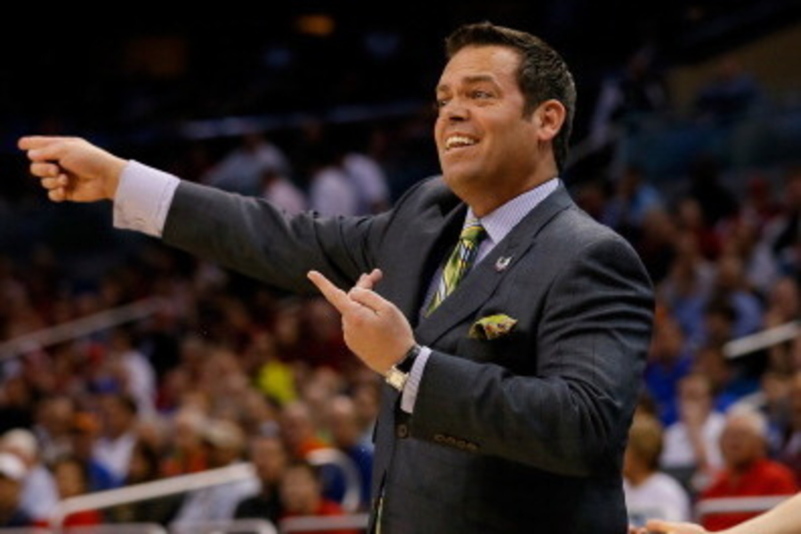 ORLANDO, FL - MARCH 20:  Head coach Steve Masiello of the Manhattan Jaspers shouts to his players against the Louisville Cardinals during the second round of the 2014 NCAA Men's Basketball Tournament at Amway Center on March 20, 2014 in Orlando, Florida. 