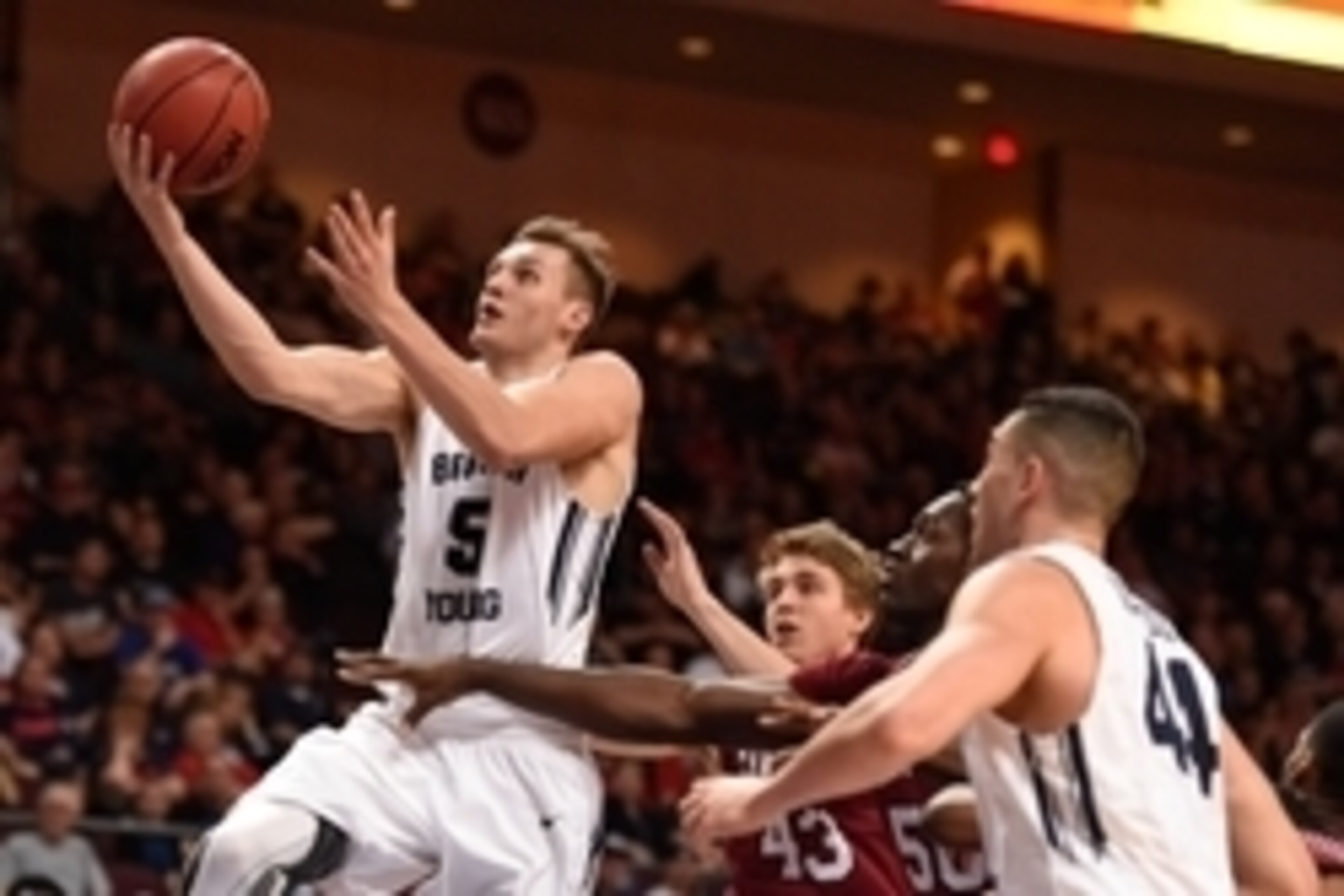 March 7, 2015; Las Vegas, NV, USA; Brigham Young Cougars guard Kyle Collinsworth (5) shoots a layup against the Santa Clara Broncos during the first half in the quarterfinals of the West Coast Conference tournament at Orleans Arena. Mandatory Credit: Kyle