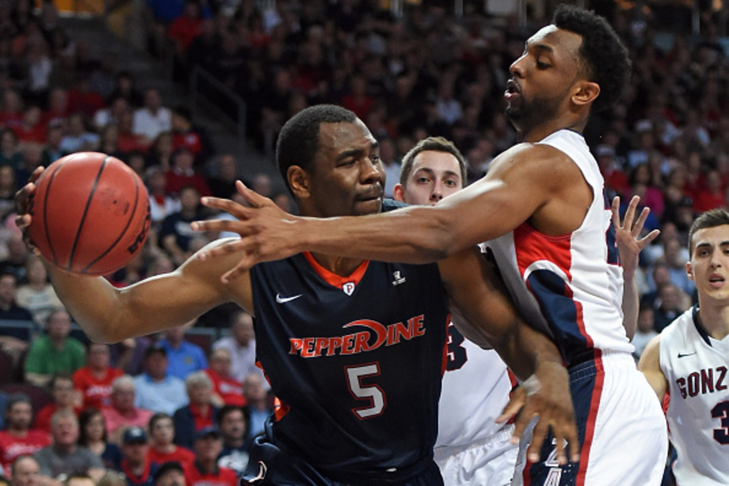 LAS VEGAS, NV - MARCH 09:  Stacy Davis #5 of the Pepperdine Waves drives against Byron Wesley #22 of the Gonzaga Bulldogs during a semifinal game of the West Coast Conference Basketball tournament at the Orleans Arena on March 9, 2015 in Las Vegas, Nevada