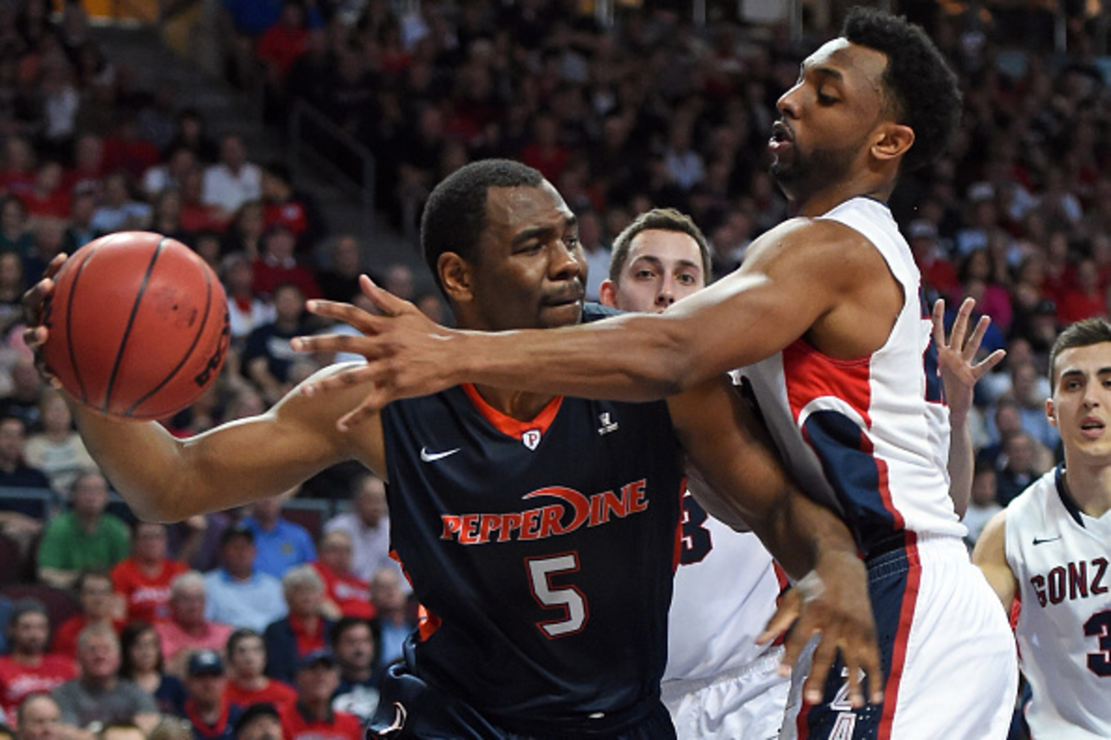 LAS VEGAS, NV - MARCH 09:  Stacy Davis #5 of the Pepperdine Waves drives against Byron Wesley #22 of the Gonzaga Bulldogs during a semifinal game of the West Coast Conference Basketball tournament at the Orleans Arena on March 9, 2015 in Las Vegas, Nevada