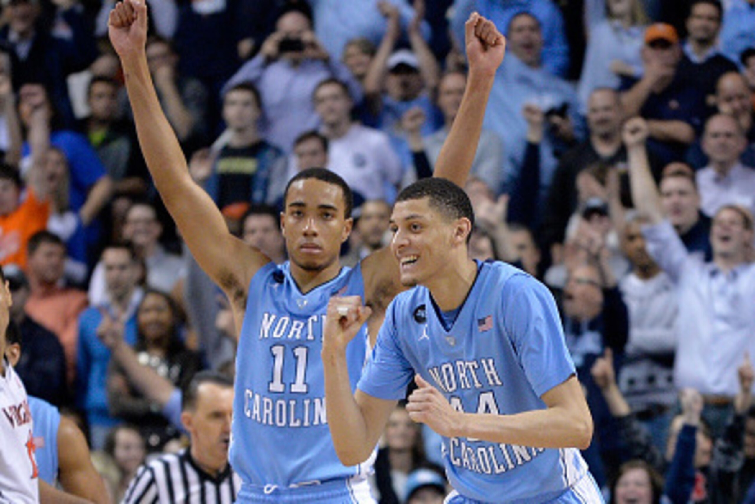GREENSBORO, NC - MARCH 13:  Teammates Justin Jackson #44 and Brice Johnson #11 of the North Carolina Tar Heels react against the Virginia Cavaliers during the semifinals of the 2015 ACC Basketball Tournament at Greensboro Coliseum on March 13, 2015 in Gre