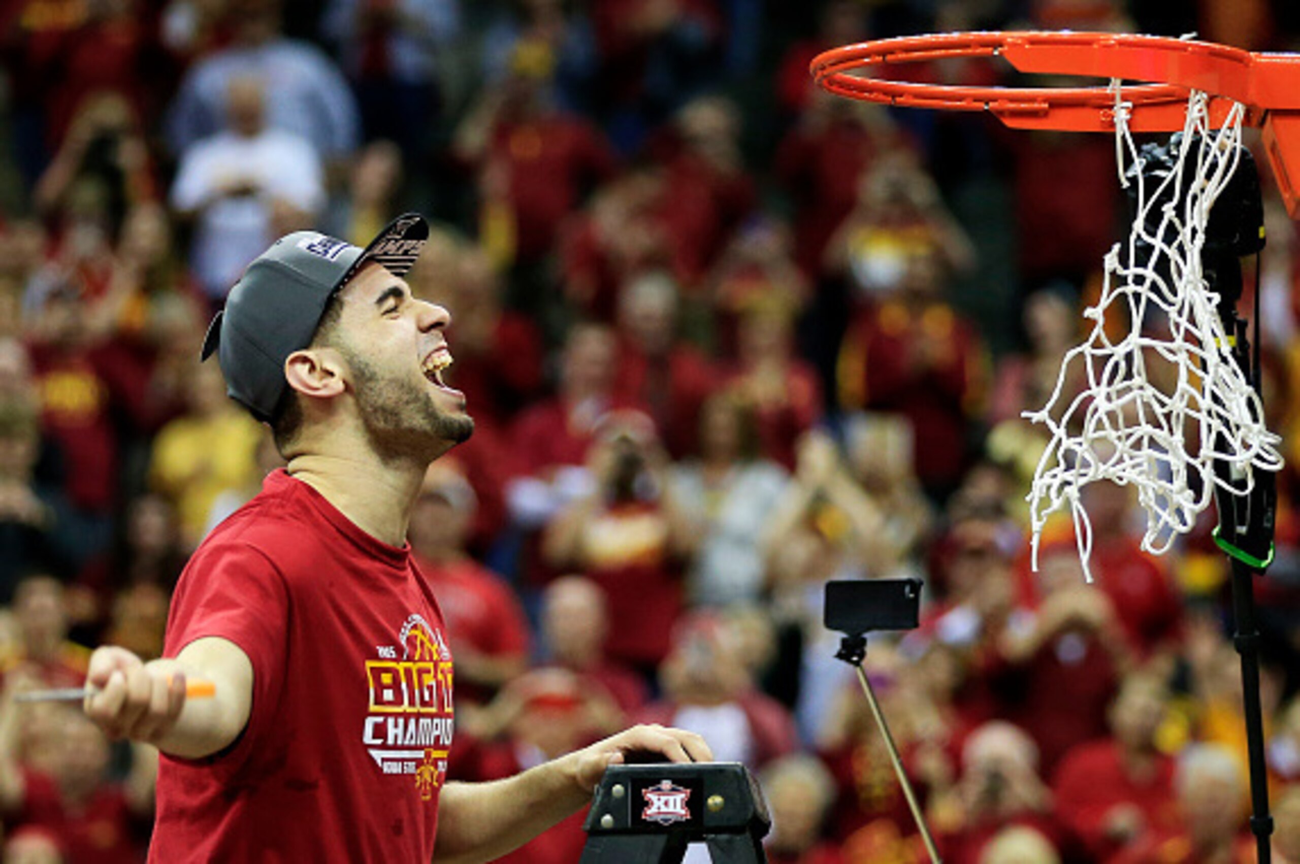 KANSAS CITY, MO - MARCH 14:  Most outstanding player Georges Niang #31 of the Iowa State Cyclones cuts down a piece of the net after their 70 to 66 victory over the Kansas Jayhawks during the championship game of the Big 12 Basketball Tournament at Sprint