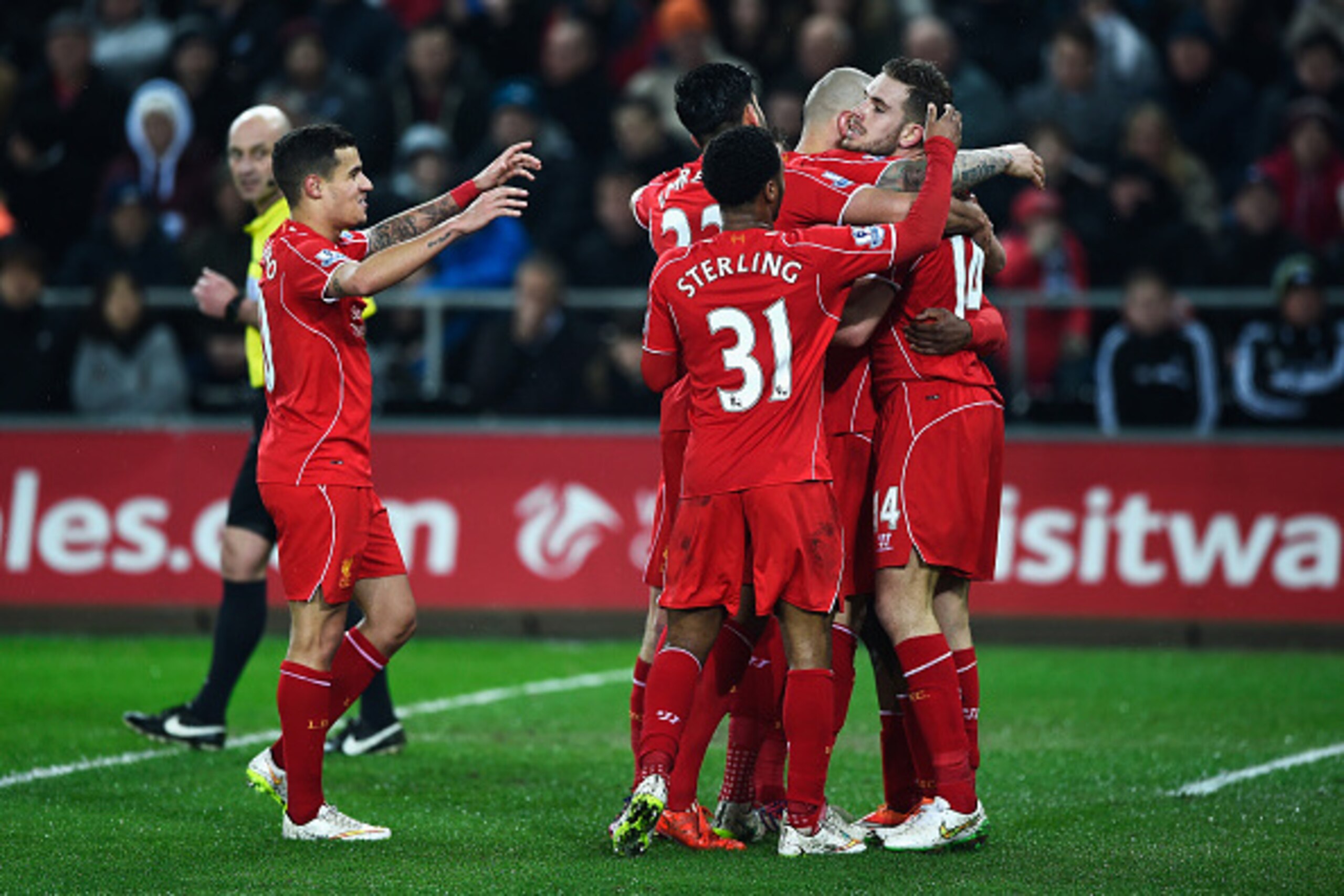 SWANSEA, WALES - MARCH 16: Jordan Henderson of Liverpool celebrates the opening goal with team mates during the Barclays Premier League match between Swansea City and Liverpool at Liberty Stadium on March 16, 2015 in Swansea, Wales. (Photo by Mike Hewit SWANSEA, WALES - MARCH 16: Jordan Henderson of Liverpool celebrates the opening goal with team mates during the Barclays Premier League match between Swansea City and Liverpool at Liberty Stadium on March 16, 2015 in Swansea, Wales. (Photo by Mike Hewit