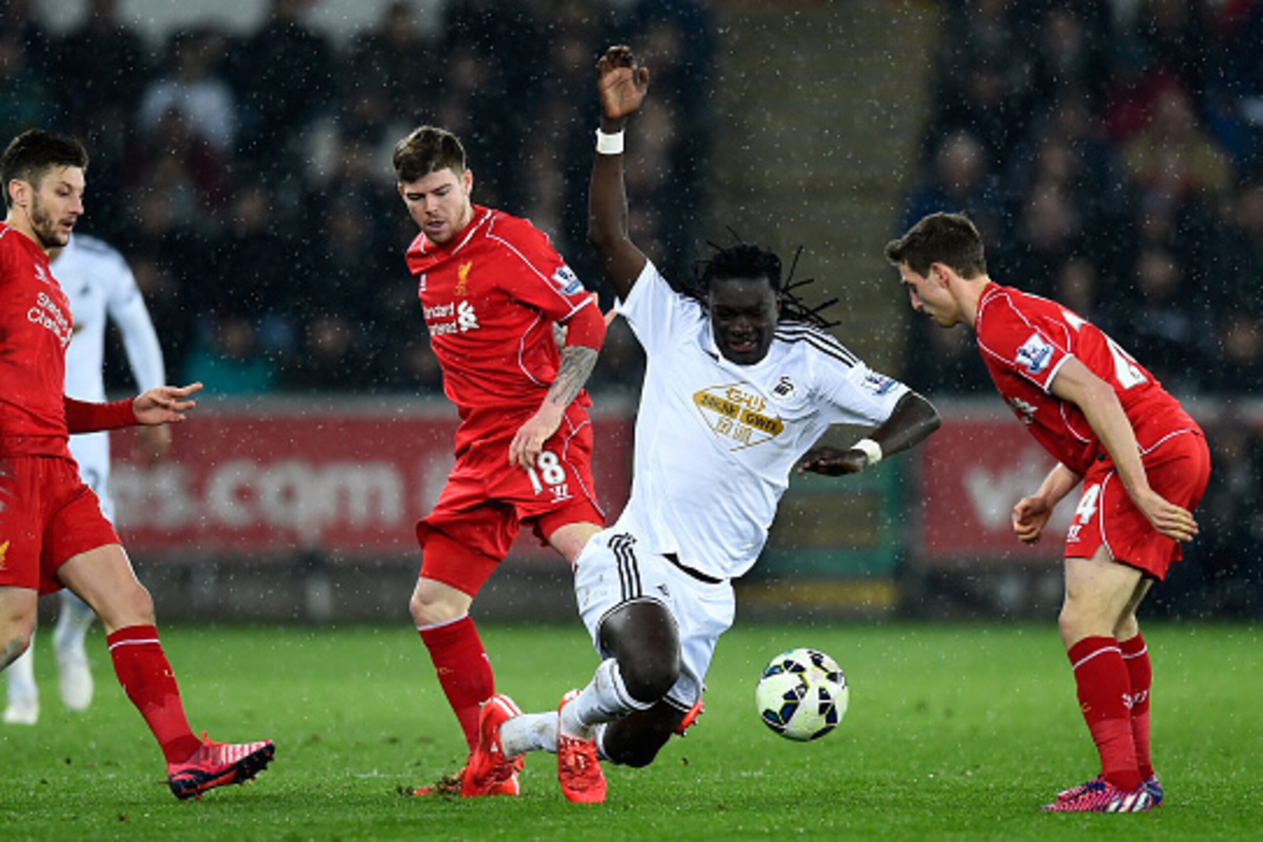 SWANSEA, WALES - MARCH 16: Swansea striker Bafetimbi Gomis is fouled during the Barclays Premiership match between Swansea City and Liverpool at Liberty Stadium on March 16, 2015 in Swansea, Wales. (Photo by Stu Forster/Getty Images) SWANSEA, WALES - MARCH 16: Swansea striker Bafetimbi Gomis is fouled during the Barclays Premiership match between Swansea City and Liverpool at Liberty Stadium on March 16, 2015 in Swansea, Wales. (Photo by Stu Forster/Getty Images)
