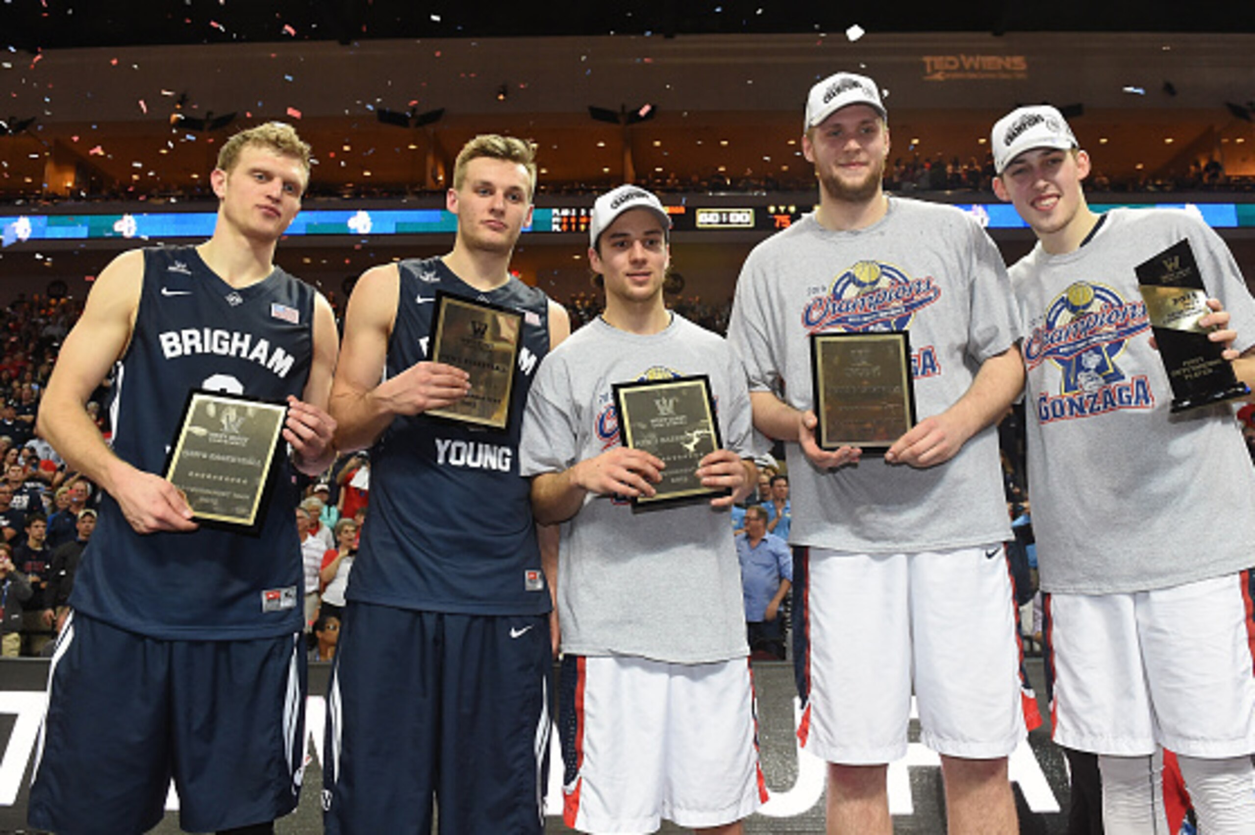 LAS VEGAS, NV - MARCH 10:  The all-tournament team award winners (L-R) Tyler Haws #3 and Kyle Collinsworth #5 of the Brigham Young Cougars, and Kevin Pangos #4, Przemek Karnowski #24 and Kyle Wiltjer #33 of the Gonzaga Bulldogs, pose after the championshi