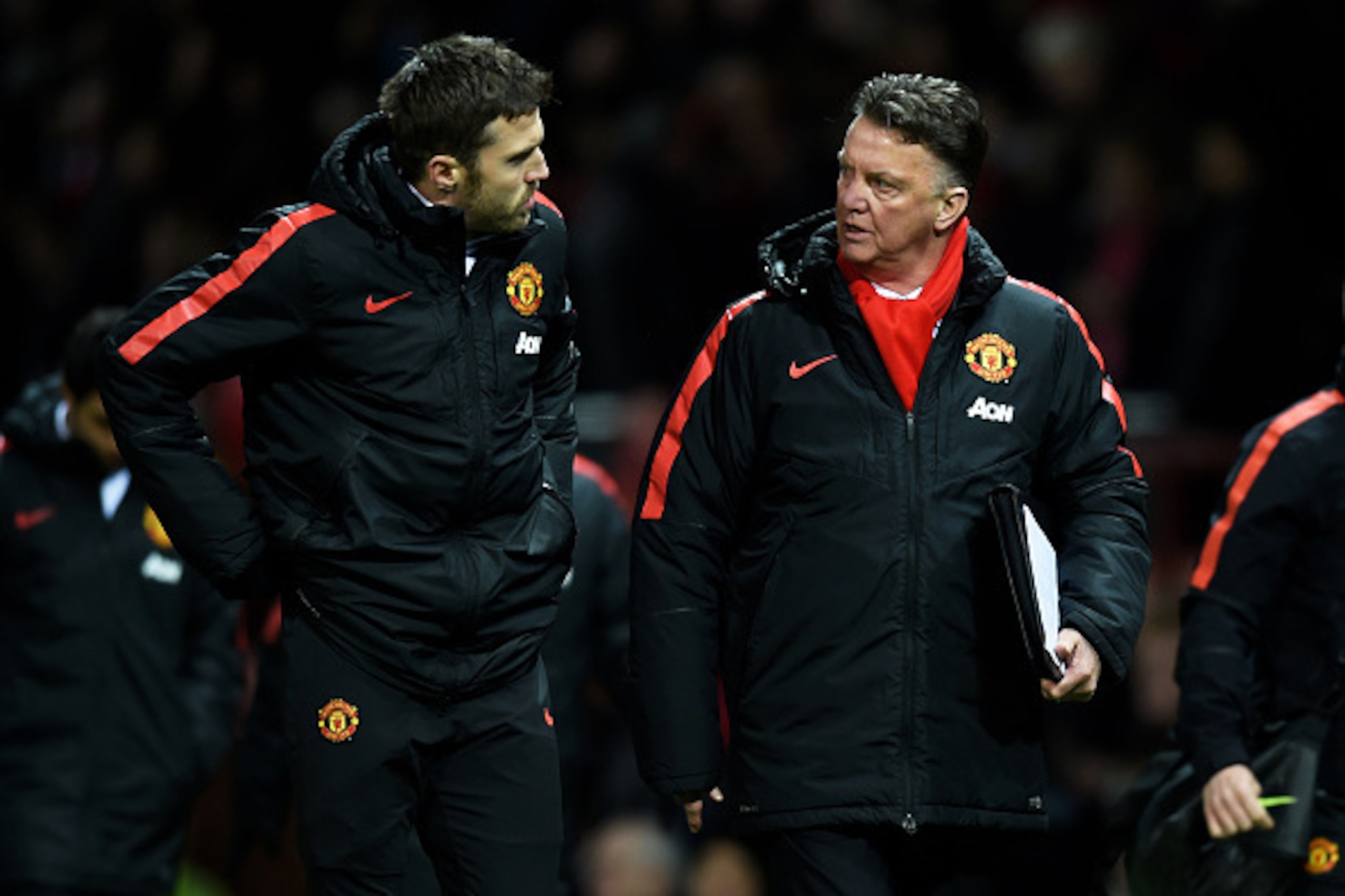 MANCHESTER, ENGLAND - MARCH 09:  Louis van Gaal the manager of Manchester United speaks with Michael Carrick of Manchester United during the FA Cup Quarter Final match between Manchester United and Arsenal at Old Trafford on March 9, 2015 in Manchester, E