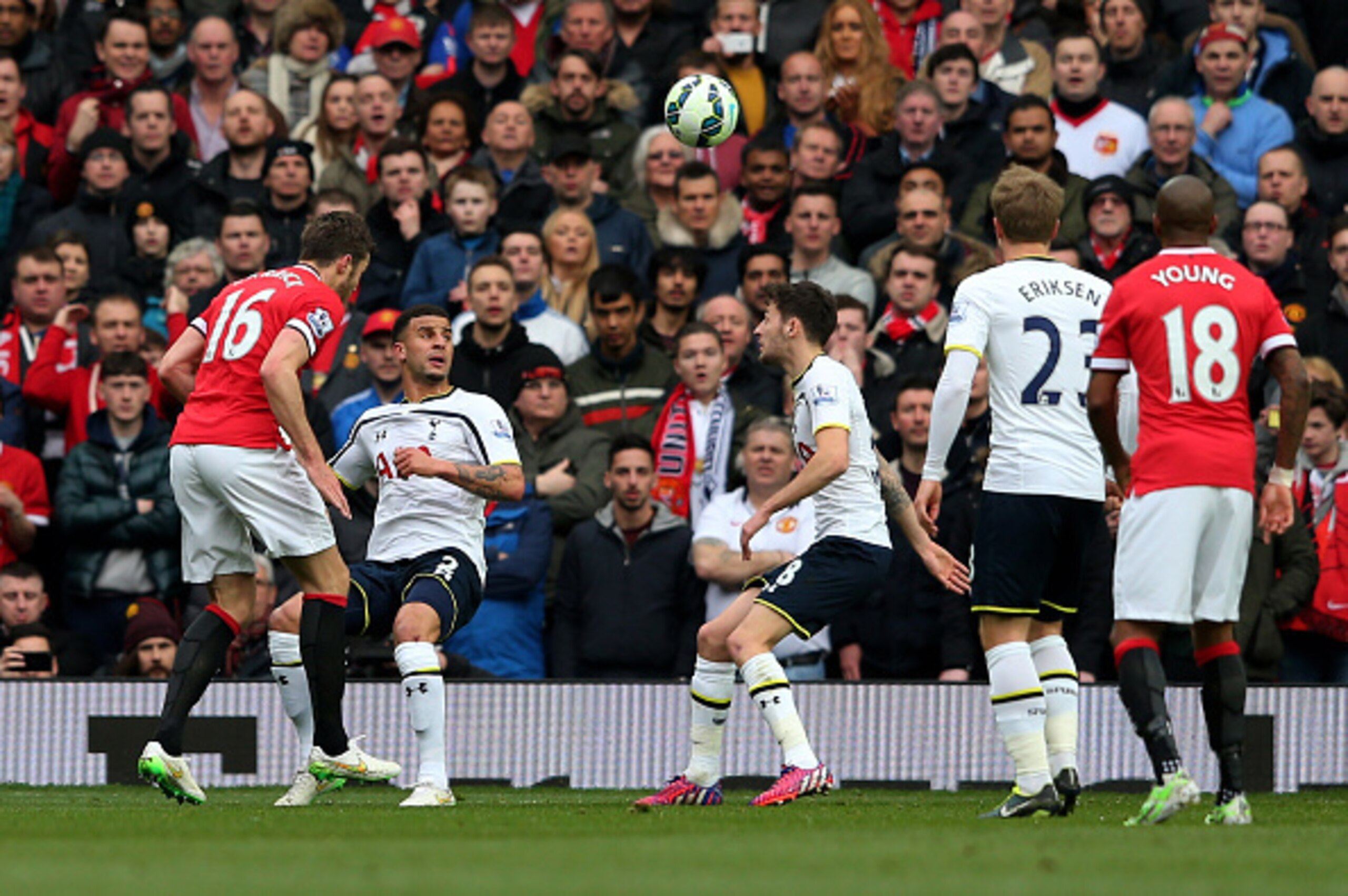 MANCHESTER, ENGLAND - MARCH 15:  Michael Carrick (L) of Manchester United scores his team's second goal with a header during the Barclays Premier League match between Manchester United and Tottenham Hotspur at Old Trafford on March 15, 2015 in Manchester,