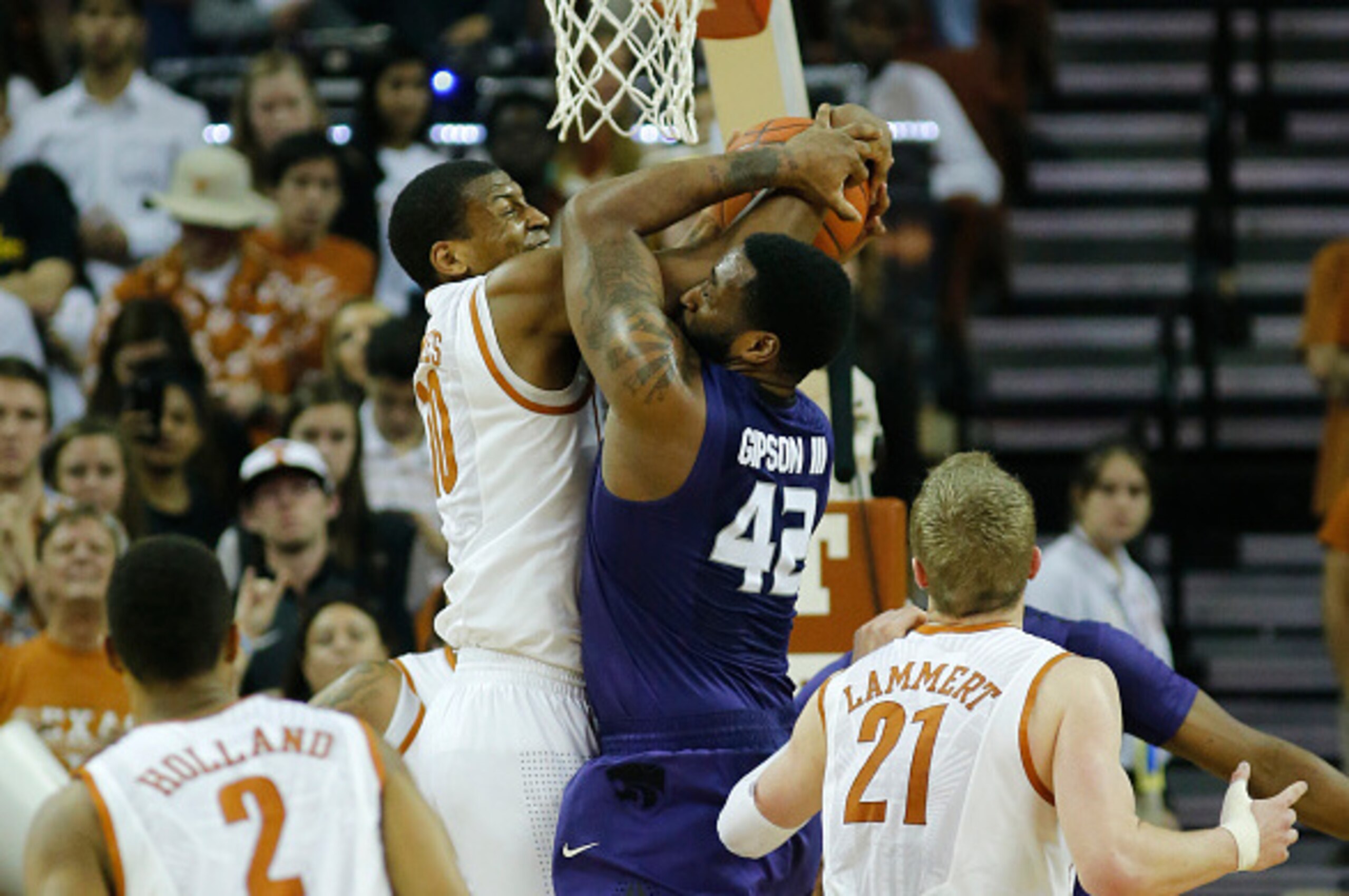 AUSTIN, TX - MARCH 7: Jonathan Holmes #10 of the Texas Longhorns fights for a rebound with Thomas Gipson #42 of the Kansas State Wildcats at the Frank Erwin Center on March 2, 2015 in Austin, Texas. (Photo by Chris Covatta/Getty Images)