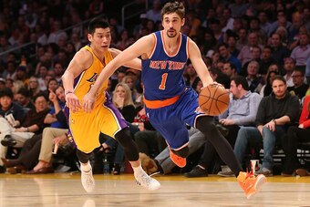LOS ANGELES, CA - MARCH 12:  Alexey Shved #1 of the New York Knicks drives past Jeremy Lin #17 of the Los Angeles Lakers at Staples Center on March 12, 2015 in Los Angeles, California.   The Knicks won 101-94.  NOTE TO USER: User expressly acknowledges an
