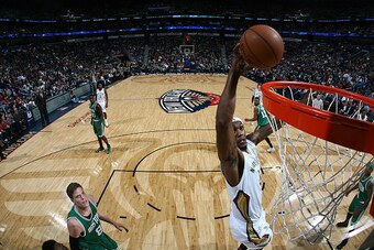 NEW ORLEANS, LA - MARCH 6:  Dante Cunningham #44 of the New Orleans Pelicans goes up for a dunk against the Boston Celtics on March 6, 2015 at the Smoothie King Center in New Orleans, Louisiana. NOTE TO USER: User expressly acknowledges and agrees that, b