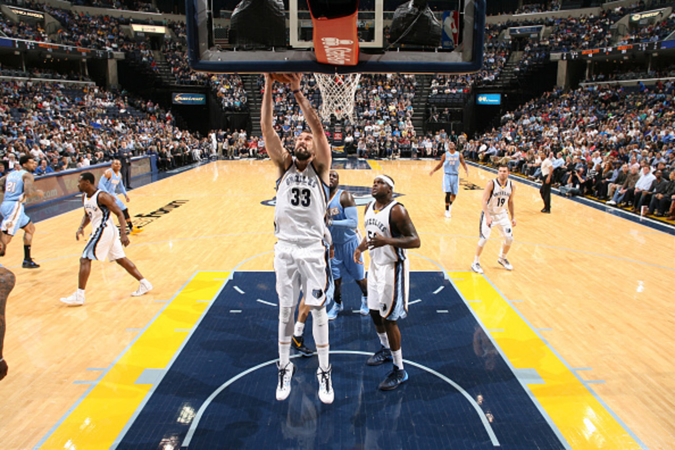 MEMPHIS, TN - MARCH 16: Marc Gasol #33 of the Memphis Grizzlies rebounds against the Denver Nuggets on March 16, 2015 at FedExForum in Memphis, Tennessee. NOTE TO USER: User expressly acknowledges and agrees that, by downloading and or using this photogra MEMPHIS, TN - MARCH 16: Marc Gasol #33 of the Memphis Grizzlies rebounds against the Denver Nuggets on March 16, 2015 at FedExForum in Memphis, Tennessee. NOTE TO USER: User expressly acknowledges and agrees that, by downloading and or using this photogra