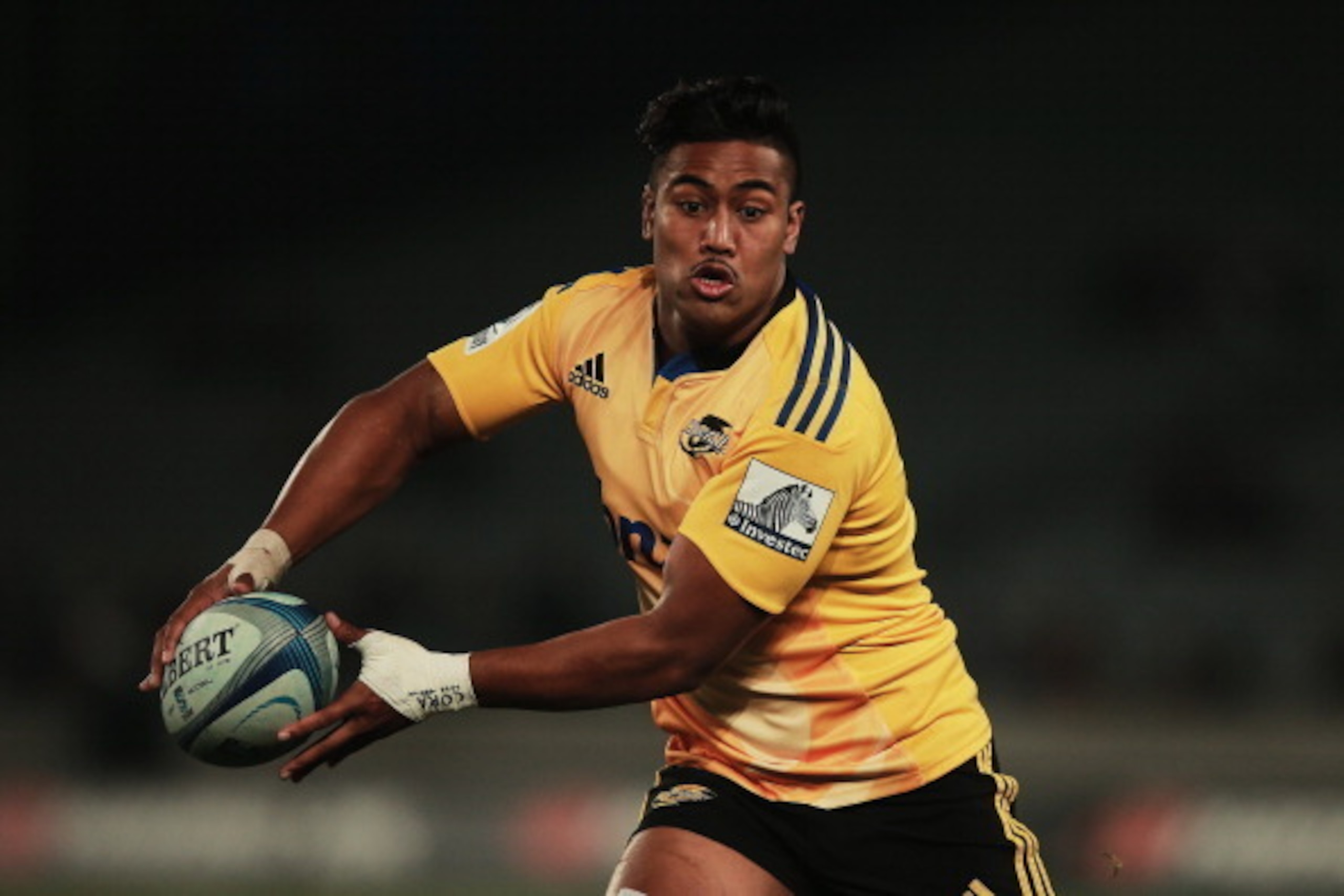 AUCKLAND, NEW ZEALAND - MAY 31: Julian Savea of the Hurricanes looks to pass the ball out during the round 16 Super Rugby match between the Blues and the Hurricanes at Eden Park on May 31, 2014 in Auckland, New Zealand.  (Photo by Hannah Peters/Getty Imag