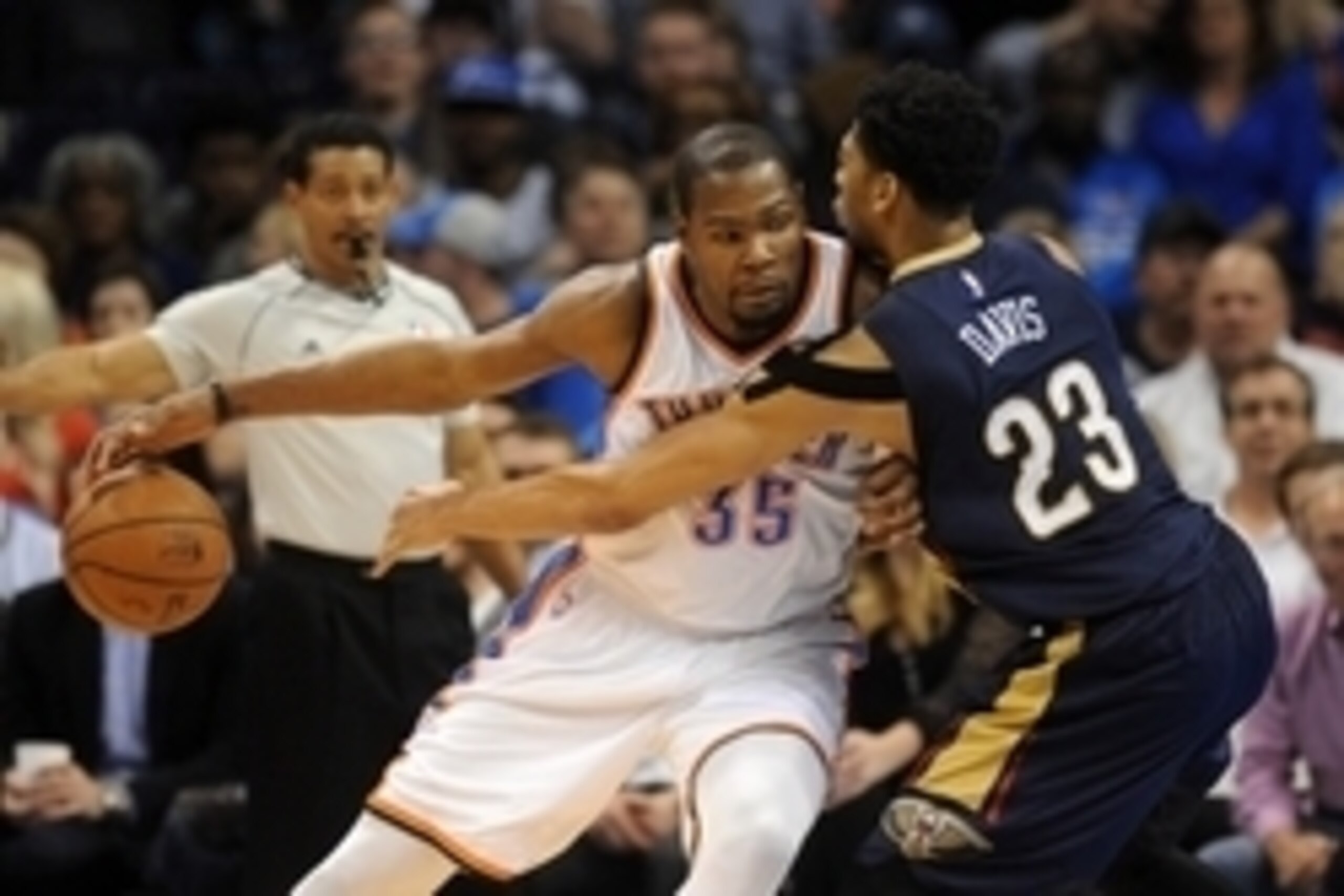Feb 6, 2015; Oklahoma City, OK, USA; Oklahoma City Thunder forward Kevin Durant (35) handles the ball against New Orleans Pelicans forward Anthony Davis (23) during the third quarter at Chesapeake Energy Arena. Mandatory Credit: Mark D. Smith-USA TODAY Sp