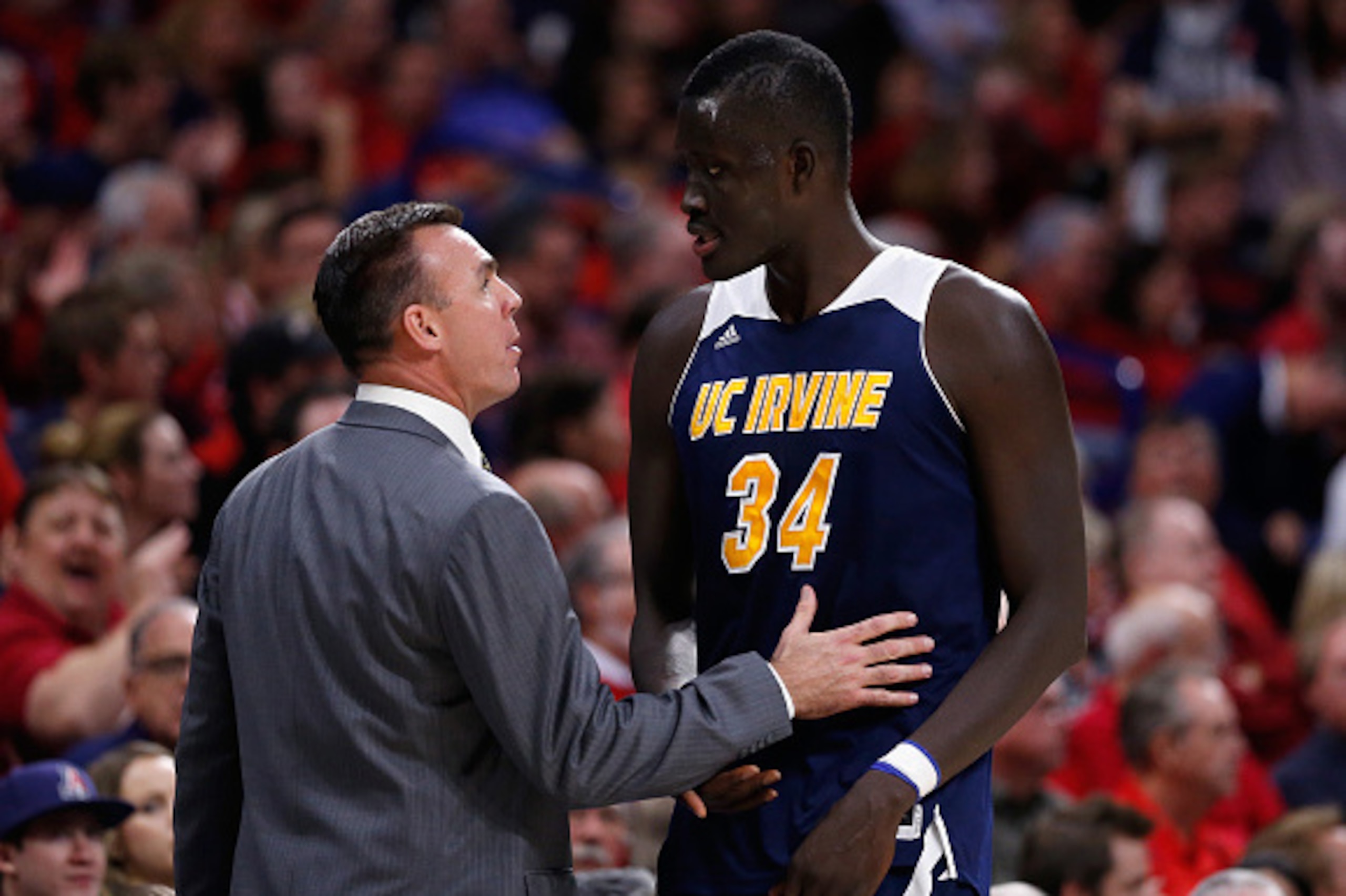 TUCSON, AZ - NOVEMBER 19: Head coach Russell Turner of the UC Irvine Anteaters talks with Mamadou Ndiaye #34 during the second half of the college basketball game against the Arizona Wildcats at McKale Center on November 19, 2014 in Tucson, Arizona. The TUCSON, AZ - NOVEMBER 19: Head coach Russell Turner of the UC Irvine Anteaters talks with Mamadou Ndiaye #34 during the second half of the college basketball game against the Arizona Wildcats at McKale Center on November 19, 2014 in Tucson, Arizona. The