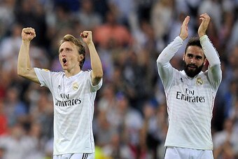 MADRID, SPAIN - OCTOBER 25:  Luka Modric and Daniel Carvajal of Real Madrid CF celebrate after Real beat FC Barcelona 3-1 during the La Liga match between Real Madrid CF and FC Barcelona at Estadio Santiago Bernabeu on October 25, 2014 in Madrid, Spain.  