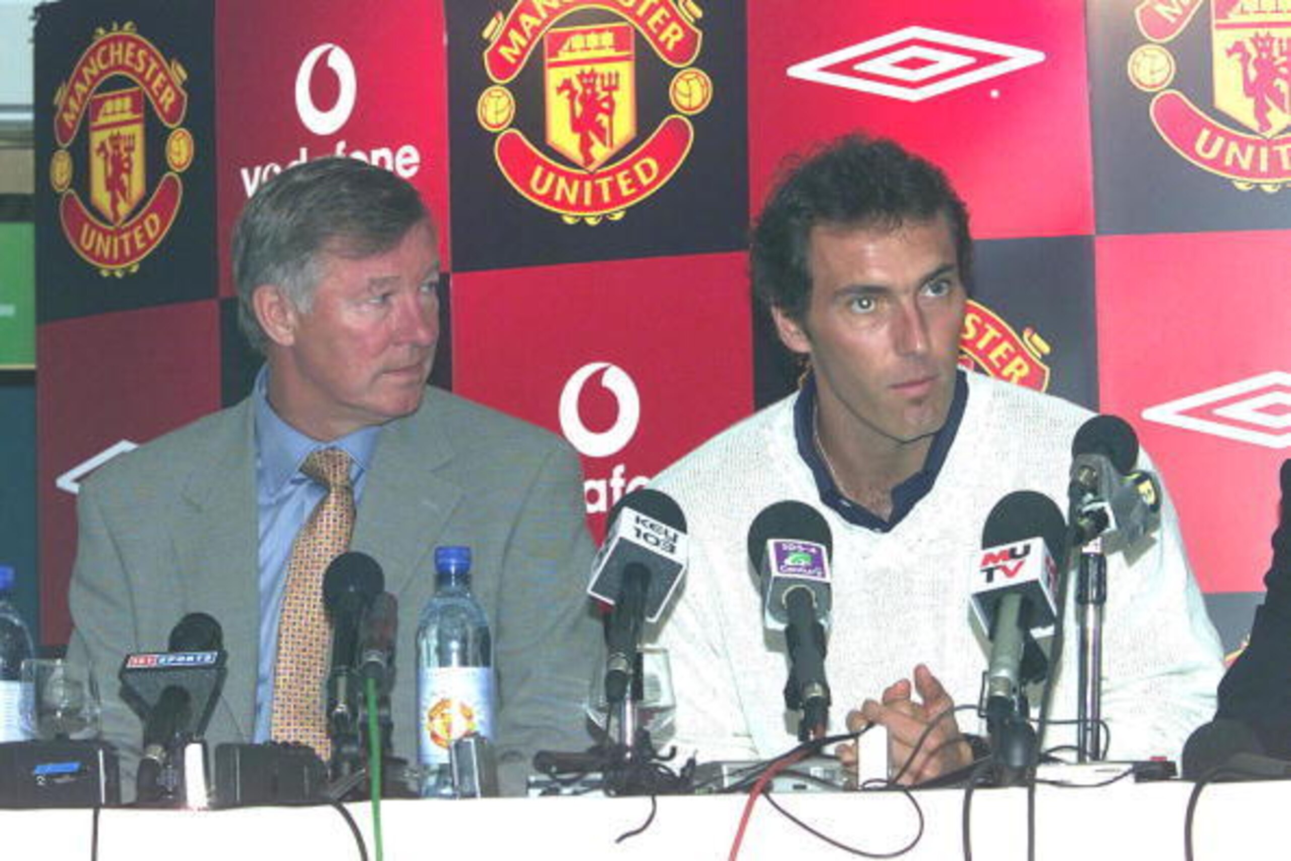30 Aug 2001:  Laurent Blanc is unveiled as Manchester United's new signing seen with manager, Alex Ferguson at a press conference at Old Trafford, Manchester. DIGITAL IMAGE. Mandatory Credit: Gary M. Prior/ALLSPORT