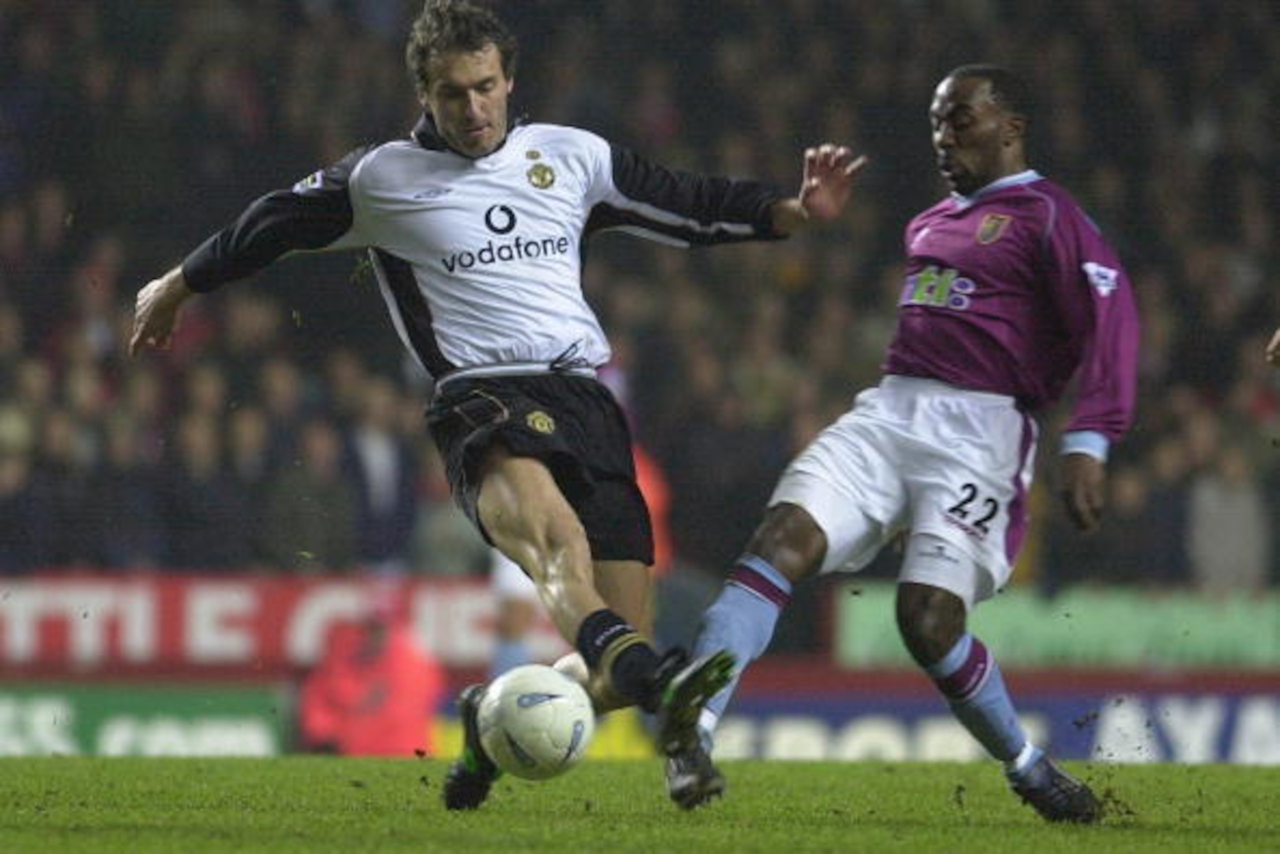 6 Jan 2002:  Laurent Blanc of Manchester United is tackled by Darrius Vassell of Aston Villa during the AXA sponsored FA Cup Third Round match between Aston Villa and Manchester United at Villa Park, Birmingham. DIGITAL IMAGE. Mandatory Credit: Ross Kinna