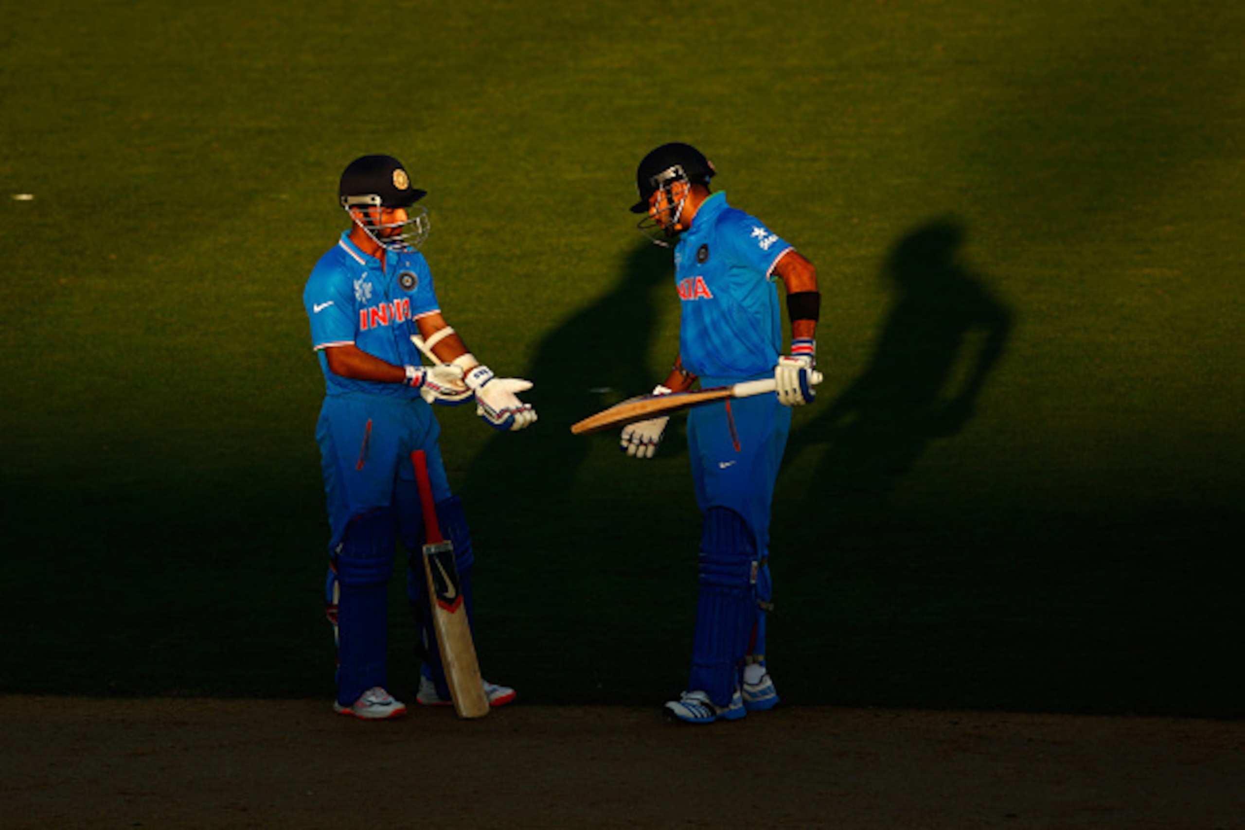AUCKLAND, NEW ZEALAND - MARCH 14: Virat Kohli (R) and Ajinkya Rahane (L) of India during the 2015 ICC Cricket World Cup match between India and Zimbabwe at Eden Park on March 14, 2015 in Auckland, New Zealand.  (Photo by Phil Walter/Getty Images)