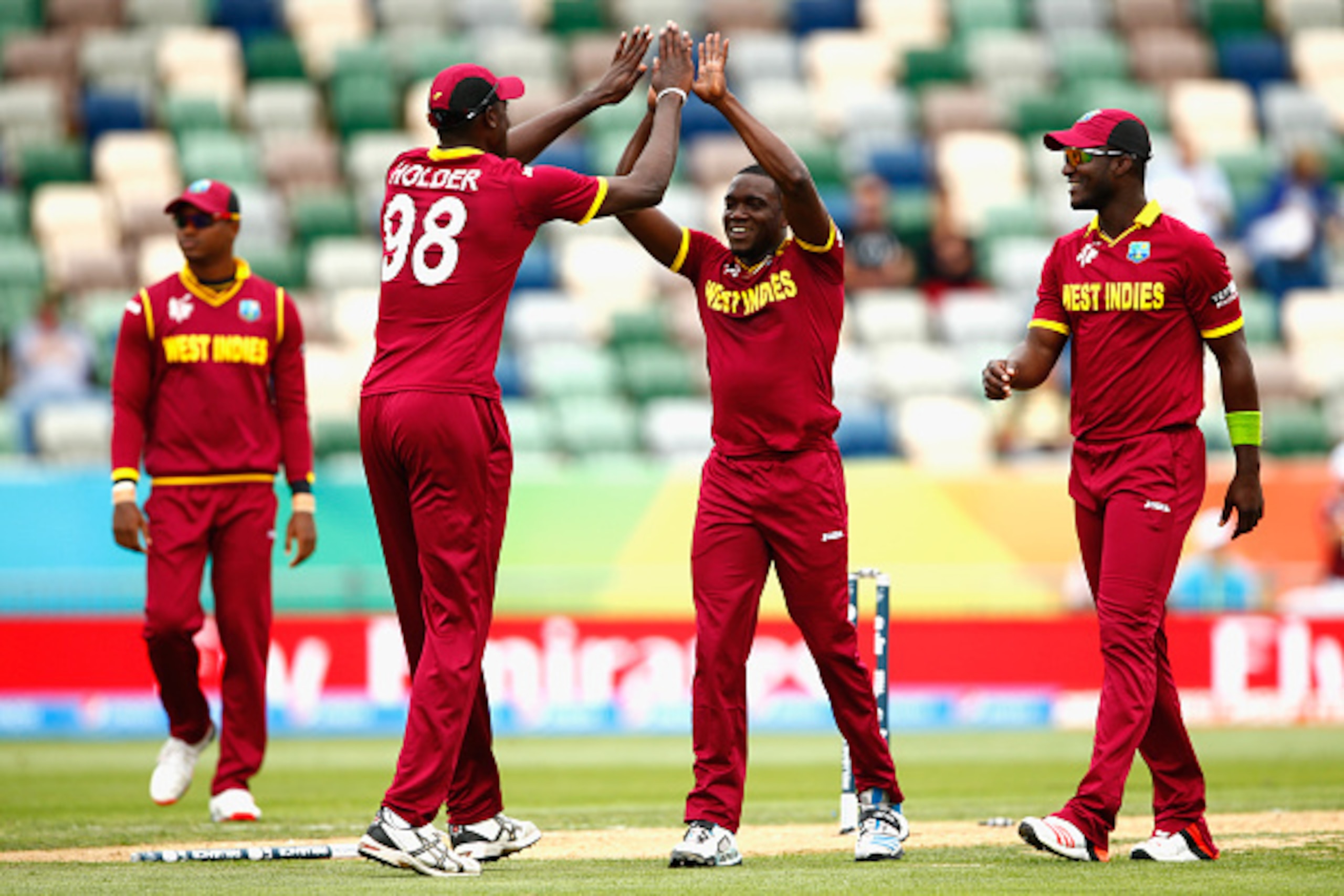 NAPIER, NEW ZEALAND - MARCH 15:  Jerome Taylor of West Indies (C) is congratulated for his wicket of Khurram Khan of the United Arab Emirates during the 2015 ICC Cricket World Cup match between the West Indies and United Arab Emirates at McLean Park on Ma