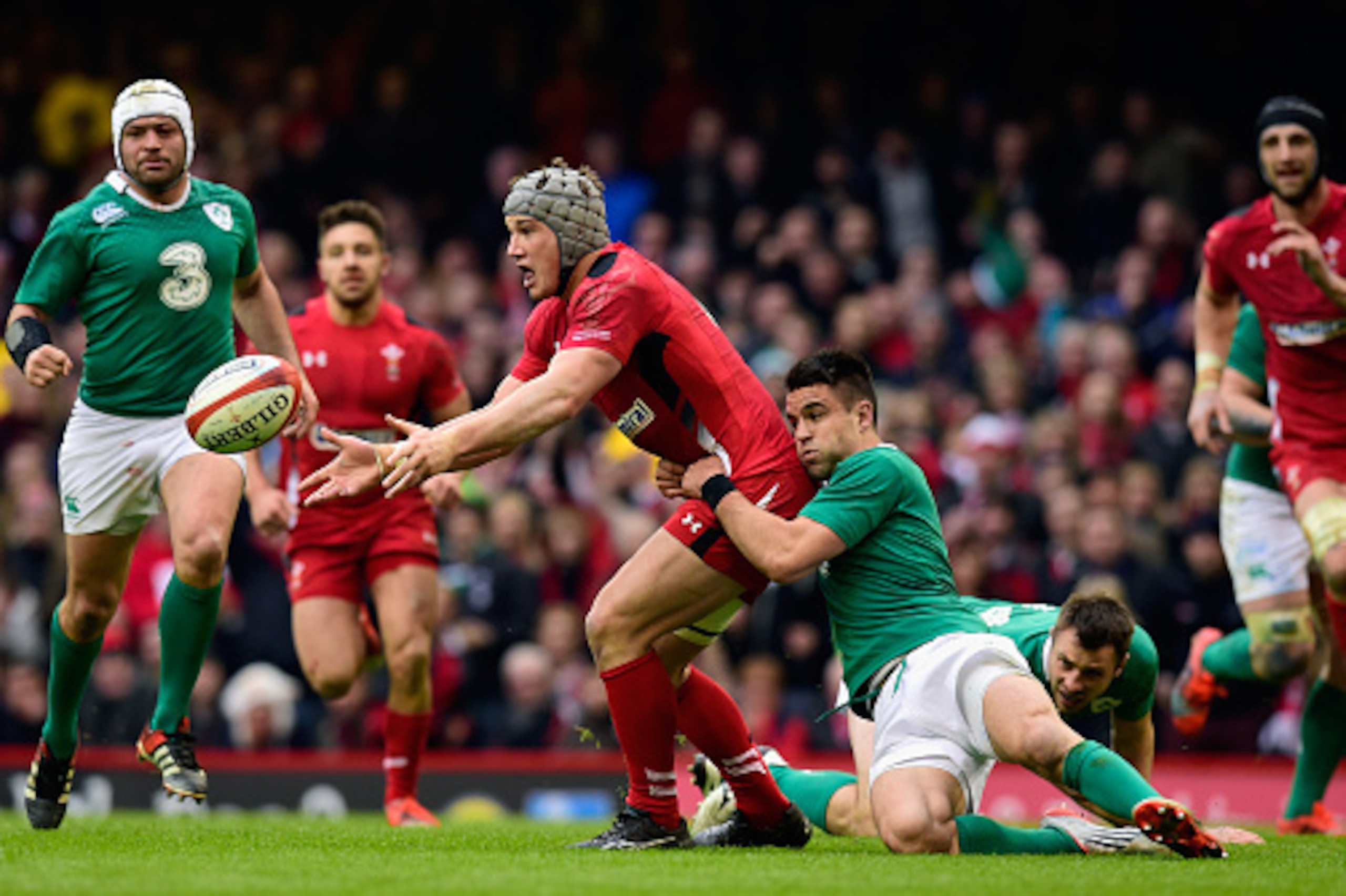CARDIFF, WALES - MARCH 14:  Ireland player Conor Murray (r) tries to stop Jonathan Davies of Wales during the RBS Six Nations match between Wales and Ireland at Millennium Stadium on March 14, 2015 in Cardiff, Wales.  (Photo by Stu Forster/Getty Images)
