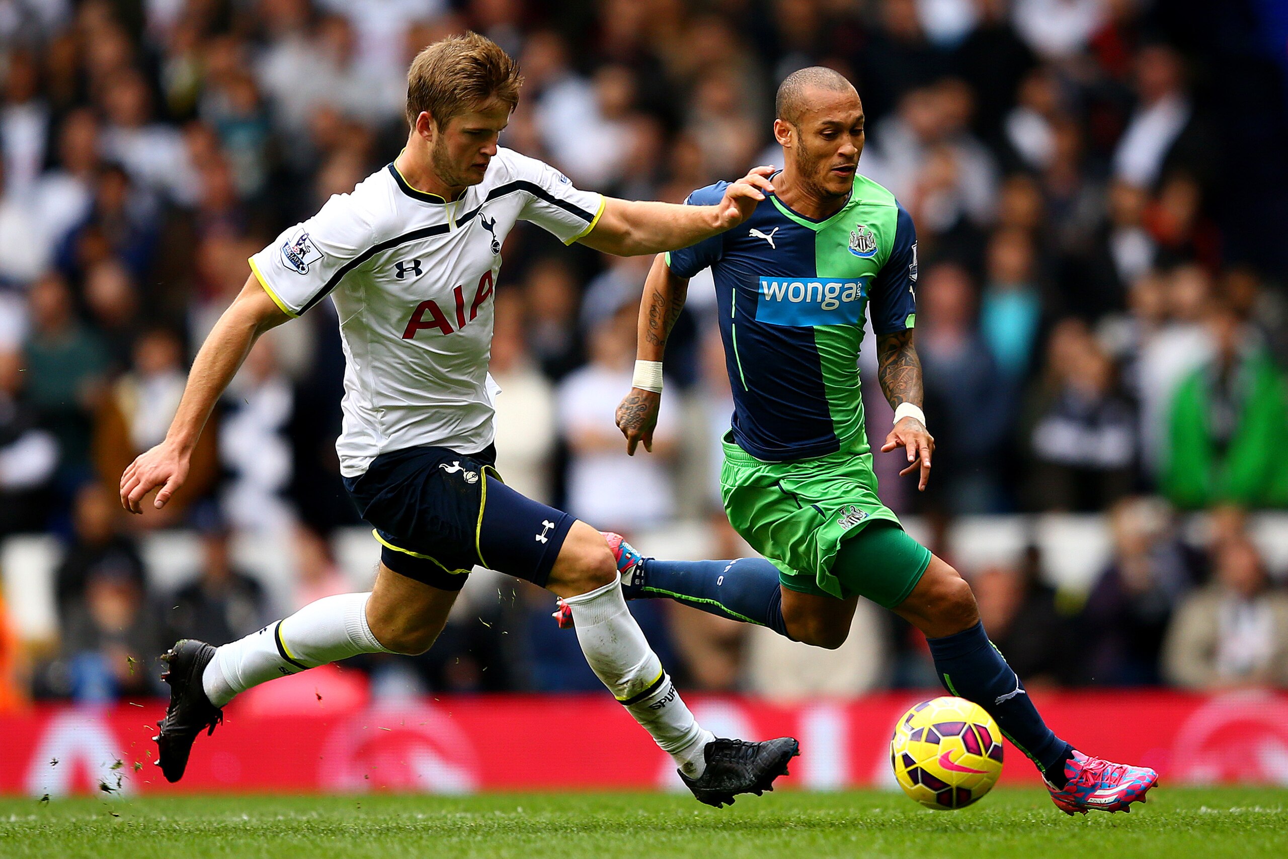 LONDON, ENGLAND - OCTOBER 26:  Eric Dier of Spurs battles for the ball with Yoan Gouffran of Newcastle United during the Barclays Premier League match between Tottenham Hotspur and Newcastle United at White Hart Lane on October 26, 2014 in London, England
