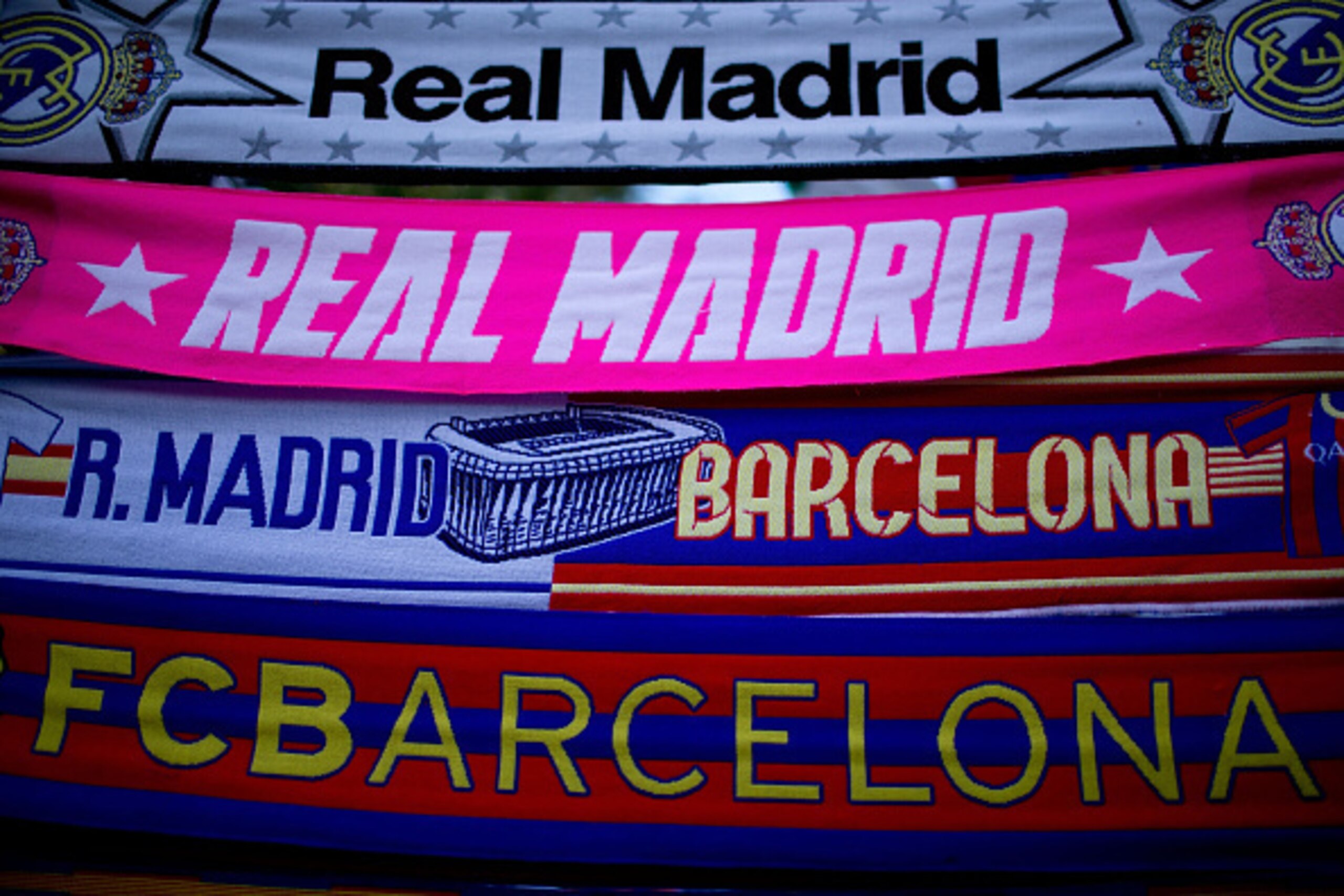 MADRID, SPAIN - OCTOBER 25: Real Madrid and Barcelona scarfs displayed at a merchandaising store before the La Liga match between Real Madrid CF and FC Barcelona at Estadio Santiago Bernabeu on October 25, 2014 in Madrid, Spain.  (Photo by Gonzalo Arroyo 
