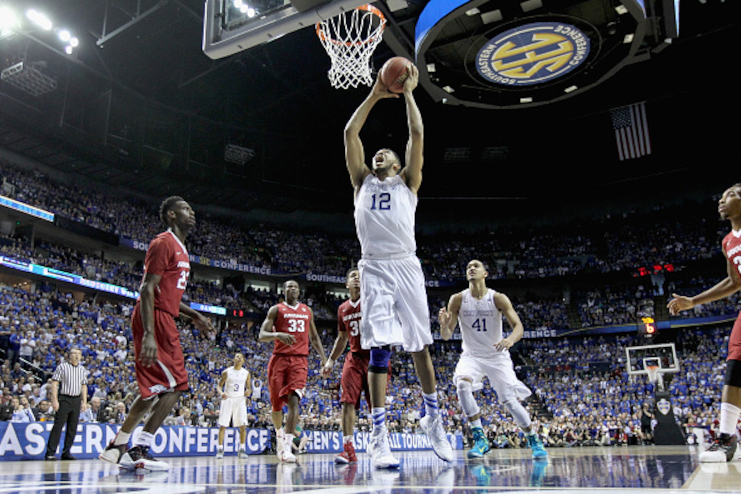 NASHVILLE, TN - MARCH 15: Karl-Anthony Towns #12 of the Kentucky Wildcats goes up for a shot against the Arkansas Razorbacks in the championship game of the SEC Basketball Tournament at Bridgestone Arena on March 15, 2015 in Nashville, Tennessee. (Photo NASHVILLE, TN - MARCH 15: Karl-Anthony Towns #12 of the Kentucky Wildcats goes up for a shot against the Arkansas Razorbacks in the championship game of the SEC Basketball Tournament at Bridgestone Arena on March 15, 2015 in Nashville, Tennessee. (Photo