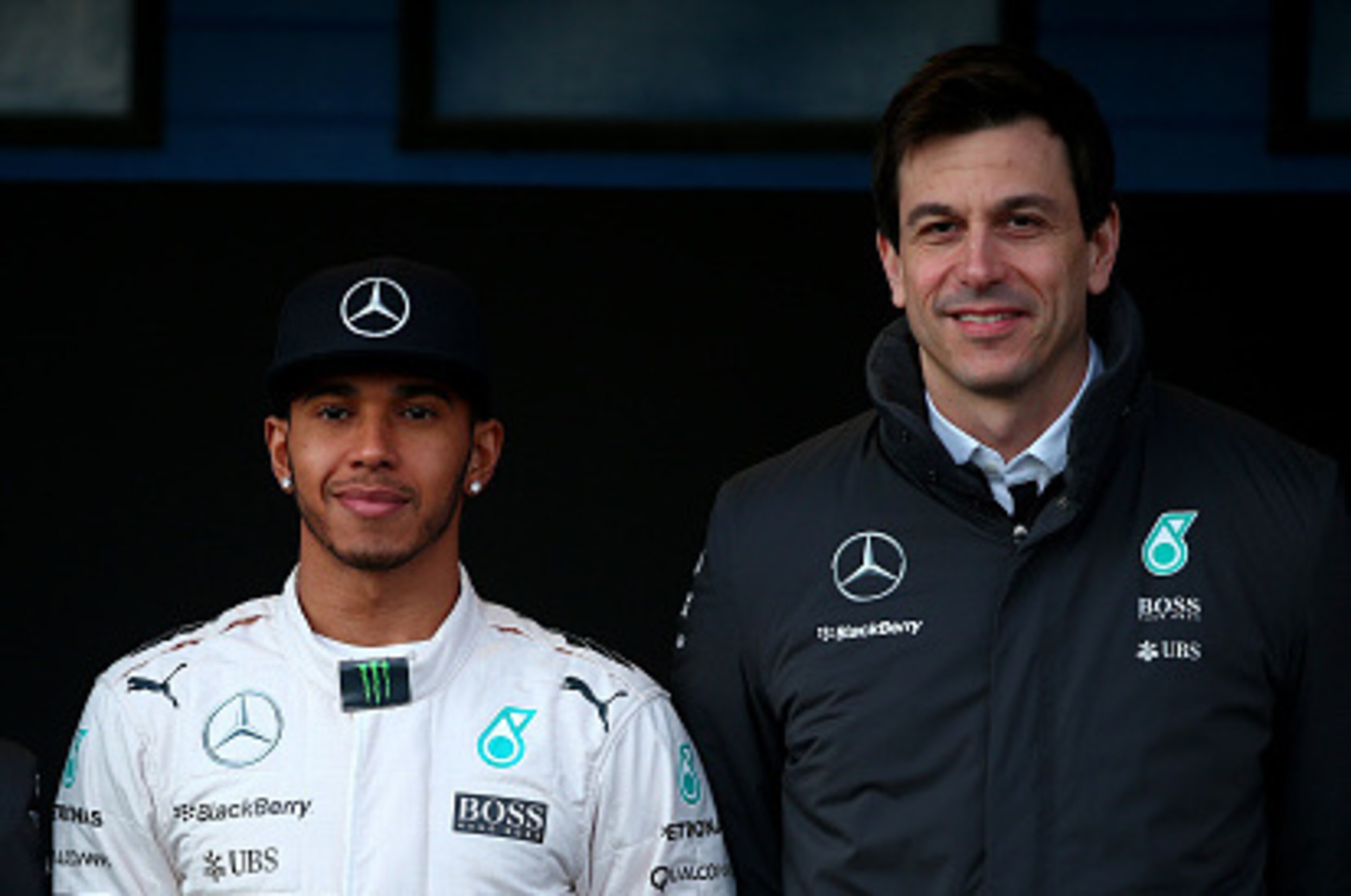 JEREZ DE LA FRONTERA, SPAIN - FEBRUARY 01:   Lewis Hamilton of Great Britain and Mercedes GP poses with Mercedes GP Executive Director Toto Wolff and Paddy Lowe, Mercedes Technical Executive Director at the launch of the new W06 outside the team garage du