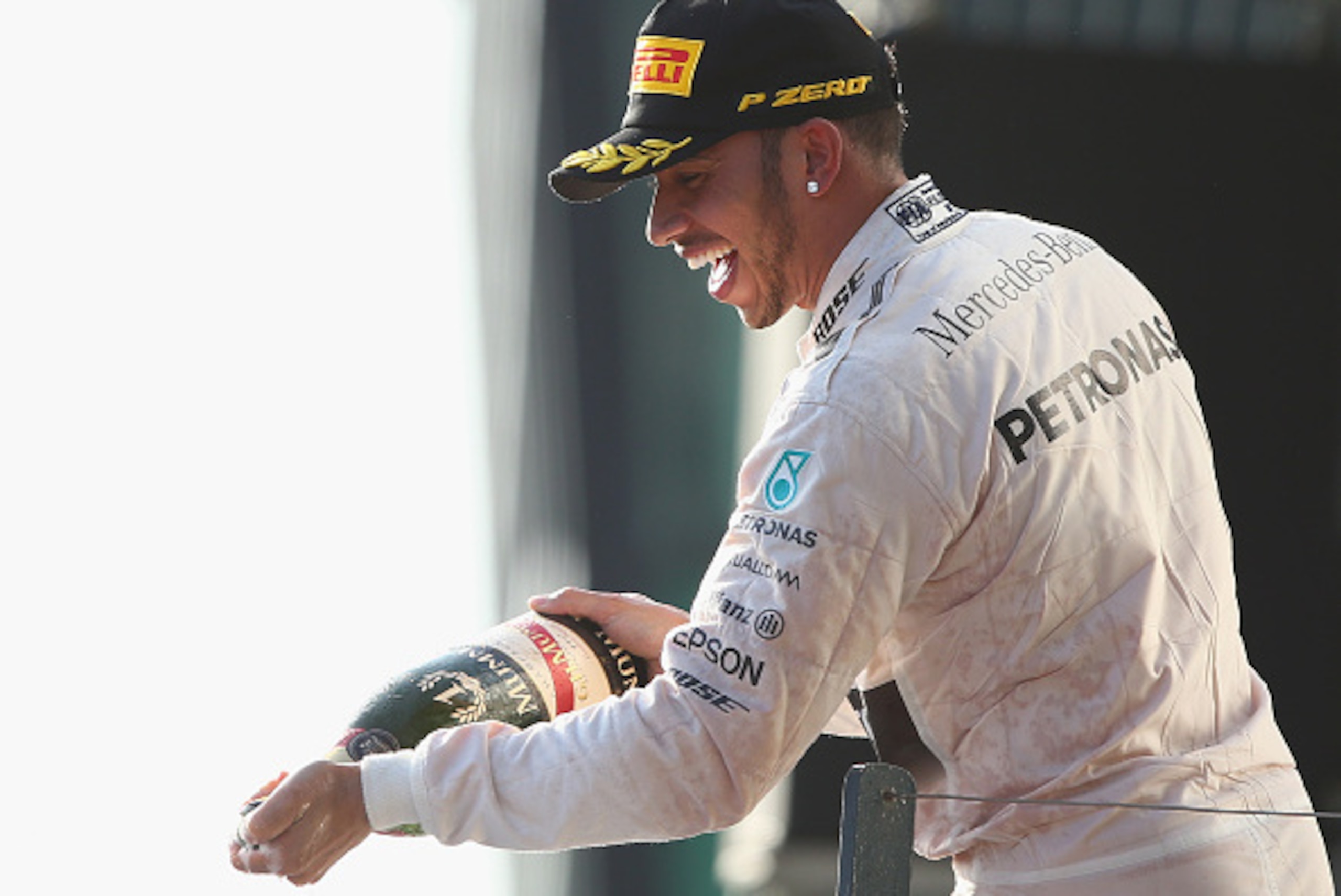 MELBOURNE, AUSTRALIA - MARCH 15:  Lewis Hamilton of Great Britain and Mercedes GP celebrates on the podium after winning the Australian Formula One Grand Prix at Albert Park on March 15, 2015 in Melbourne, Australia.  (Photo by Robert Cianflone/Getty Imag