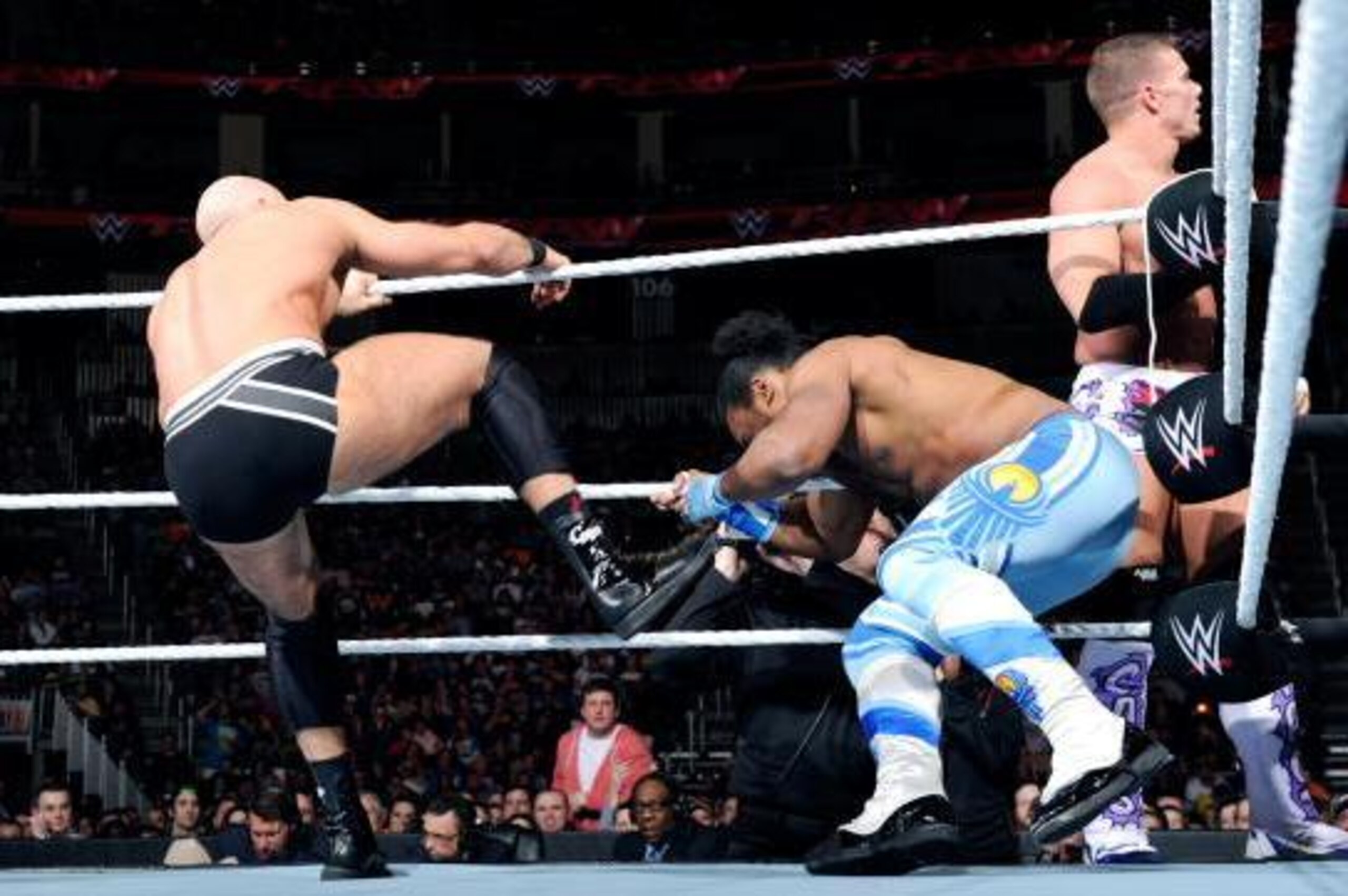 Cesaro attacks Xavier Woods.