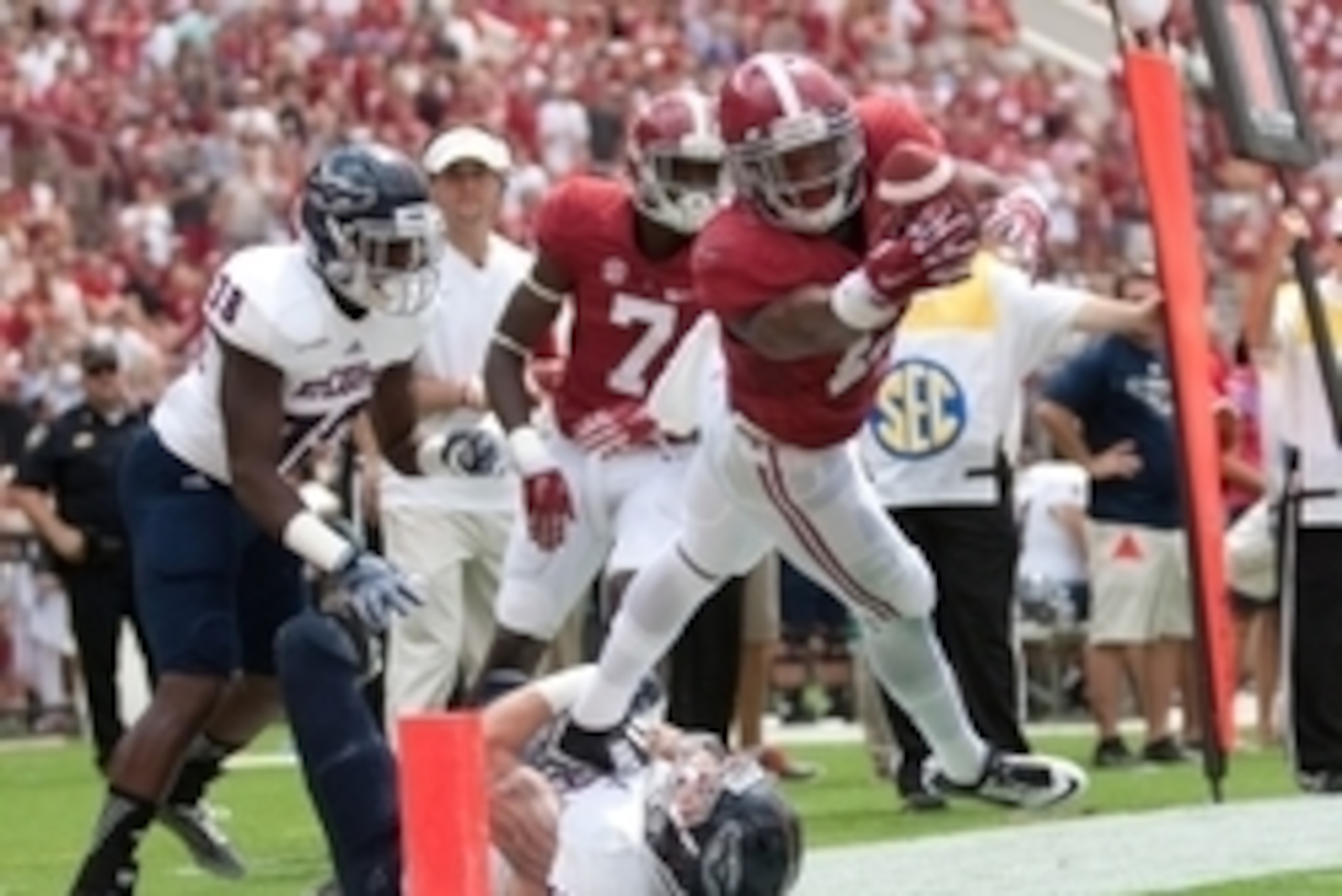 Sep 6, 2014; Tuscaloosa, AL, USA; Alabama Crimson Tide running back Kenyan Drake (17) is hit from behind by Florida Atlantic Owls linebacker Nate Ozdemir (50) just short of the goal in at Bryant-Denny Stadium. Mandatory Credit: Marvin Gentry-USA TODAY Spo