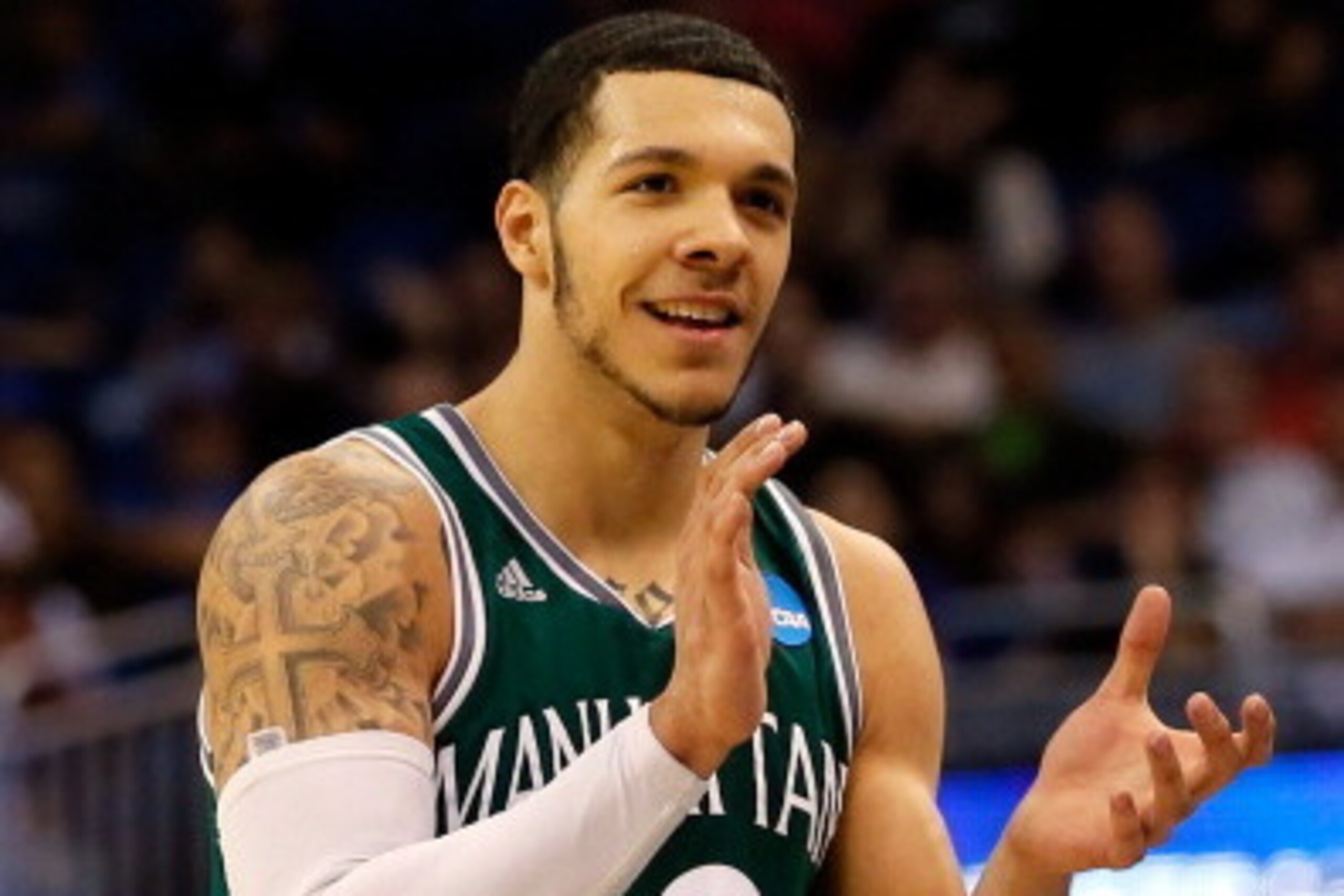 ORLANDO, FL - MARCH 20:  Emmy Andujar #13 of the Manhattan Jaspers reacts after turnover against the Louisville Cardinals during the second round of the 2014 NCAA Men's Basketball Tournament at Amway Center on March 20, 2014 in Orlando, Florida.  (Photo b
