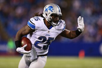 ORCHARD PARK, NY - AUGUST 28:  Mikel Leshoure #25 of the Detroit Lions runs to the outside during the second half of a preseason game against the Buffalo Bills at Ralph Wilson Stadium on August 28, 2014 in Orchard Park, New York.  (Photo by Vaughn Ridley/