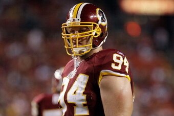 LANDOVER, MD - SEPTEMBER 01:  Adam Carriker #94 of the Washington Redskins  waits for play to resume against the Tampa Bay Buccaneers during the first half of a preseason game at FedExField on September 1, 2011 in Landover, Maryland.  (Photo by Rob Carr/G