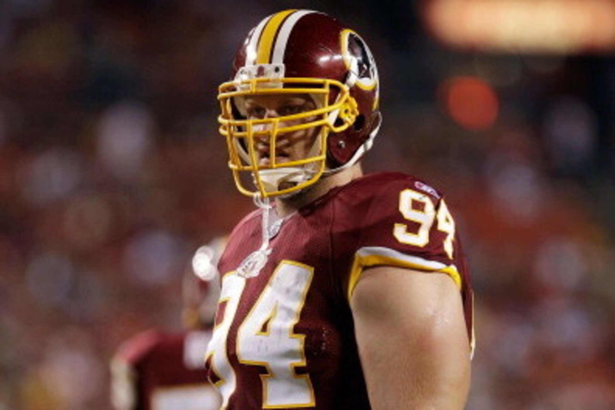 LANDOVER, MD - SEPTEMBER 01:  Adam Carriker #94 of the Washington Redskins  waits for play to resume against the Tampa Bay Buccaneers during the first half of a preseason game at FedExField on September 1, 2011 in Landover, Maryland.  (Photo by Rob Carr/G