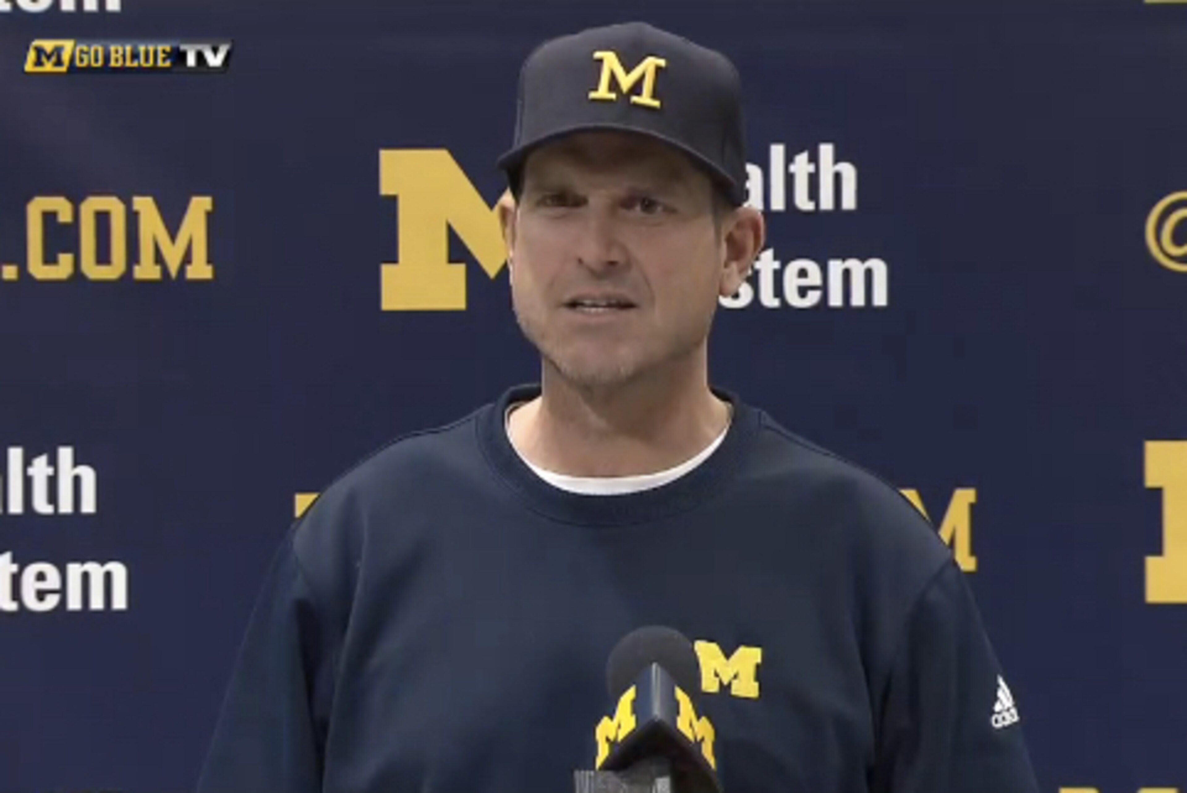 Harbaugh in his Schembechler-style hat. Harbaugh in his Schembechler-style hat.