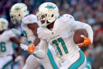 Dec 14, 2014; Foxborough, MA, USA; dMiami Dolphins wide receiver Mike Wallace (11) runs the ball against the New England Patriots during the first half at Gillette Stadium. Mandatory Credit: Winslow Townson-USA TODAY Sports