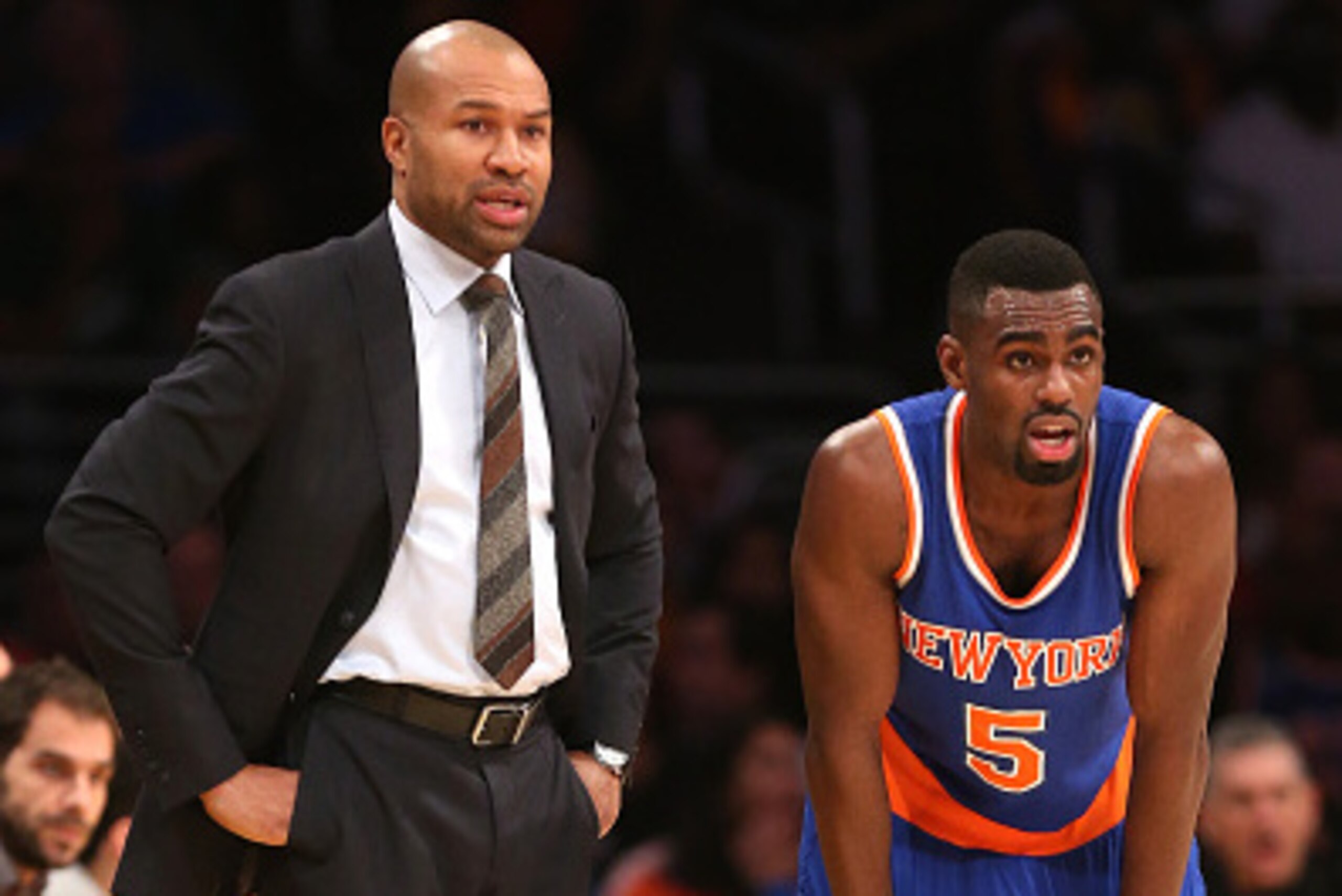 LOS ANGELES, CA - MARCH 12:  Head coach Derek Fisher and Tim Hardaway Jr. #5 of the New York Knicks consult during the game with the Los Angeles Lakers after the game at Staples Center on March 12, 2015 in Los Angeles, California.   The Knicks won 101-94.