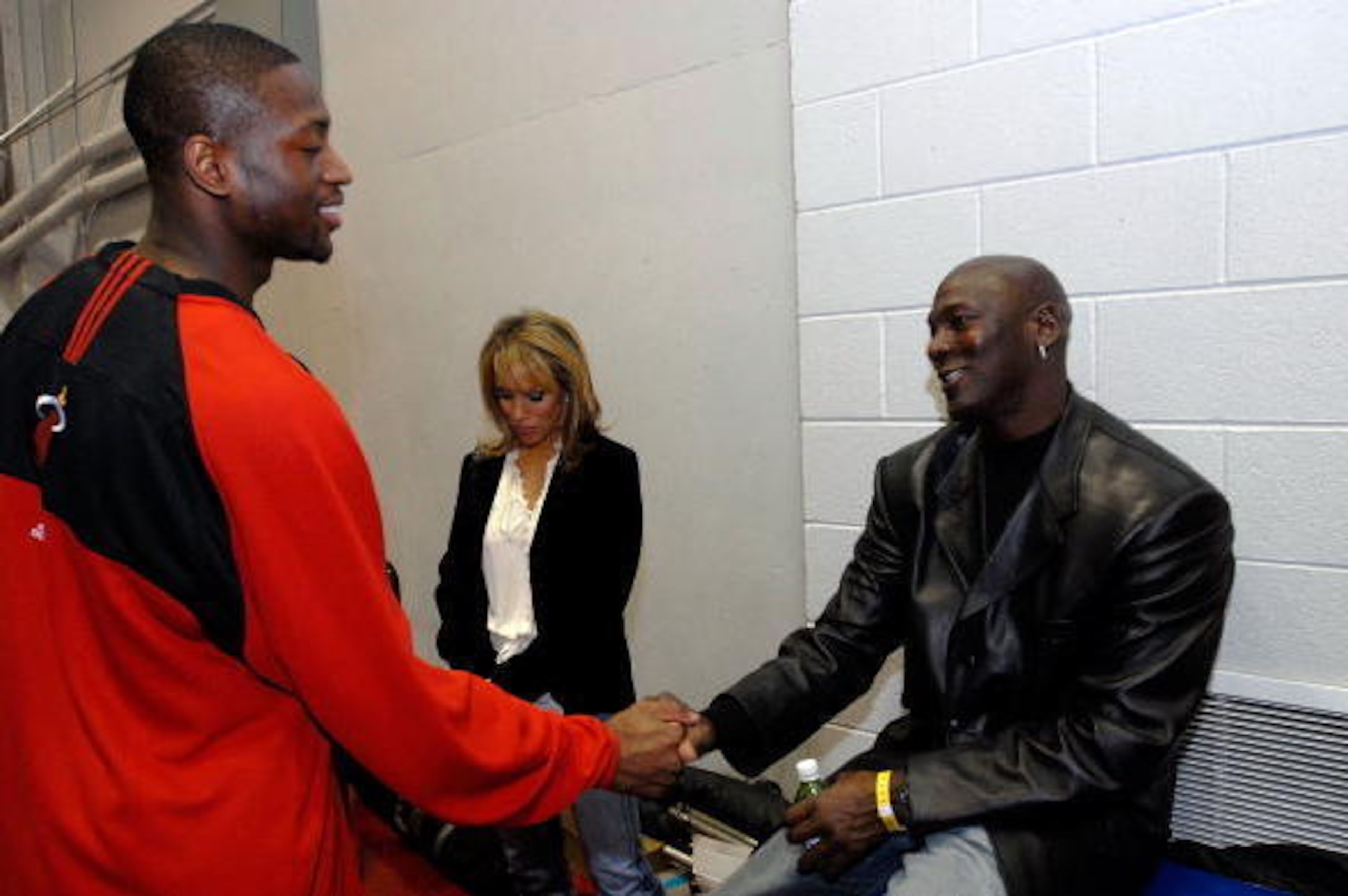 LAS VEGAS - FEBRUARY 17: (R-L) NBA legend Michael Jordan shakes hands with Dwyane Wade of the Miami Heat before the Sprite Slam Dunk Competition at NBA All-Star Weekend on February 17, 2007 at Thomas & Mack Center in Las Vegas, Nevada. NOTE TO USER: User LAS VEGAS - FEBRUARY 17: (R-L) NBA legend Michael Jordan shakes hands with Dwyane Wade of the Miami Heat before the Sprite Slam Dunk Competition at NBA All-Star Weekend on February 17, 2007 at Thomas & Mack Center in Las Vegas, Nevada. NOTE TO USER: User