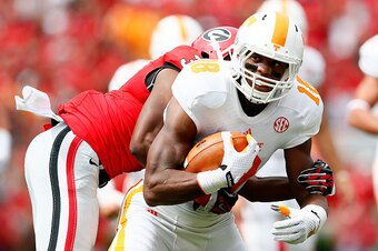 ATHENS, GA - SEPTEMBER 27:  Jason Croom #18 of the Tennessee Volunteers pulls in this reception against Aaron Davis #35 of the Georgia Bulldogs at Sanford Stadium on September 27, 2014 in Athens, Georgia.  (Photo by Kevin C. Cox/Getty Images)