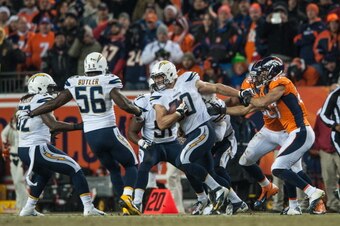 DENVER, CO - DECEMBER 12:  Linebacker Thomas Keiser #90 of the San Diego Chargers has a fourth quarter interception against the Denver Broncos at Sports Authority Field Field at Mile High on December 12, 2013 in Denver, Colorado.  (Photo by Dustin Bradfor