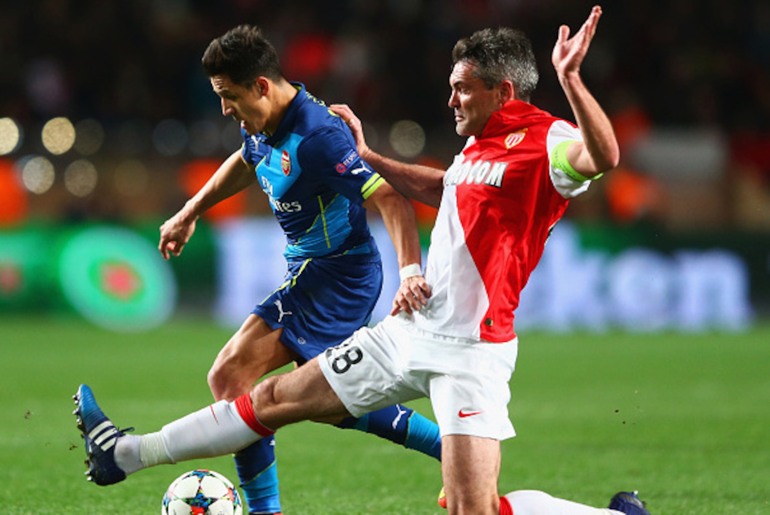 MONACO - MARCH 17:  Alexis Sanchez of Arsenal takes on Jeremy Toulalan of Monaco during the UEFA Champions League round of 16 second leg match between AS Monaco and Arsenal at Stade Louis II on March 17, 2015 in Monaco, Monaco.  (Photo by Michael Steele/G